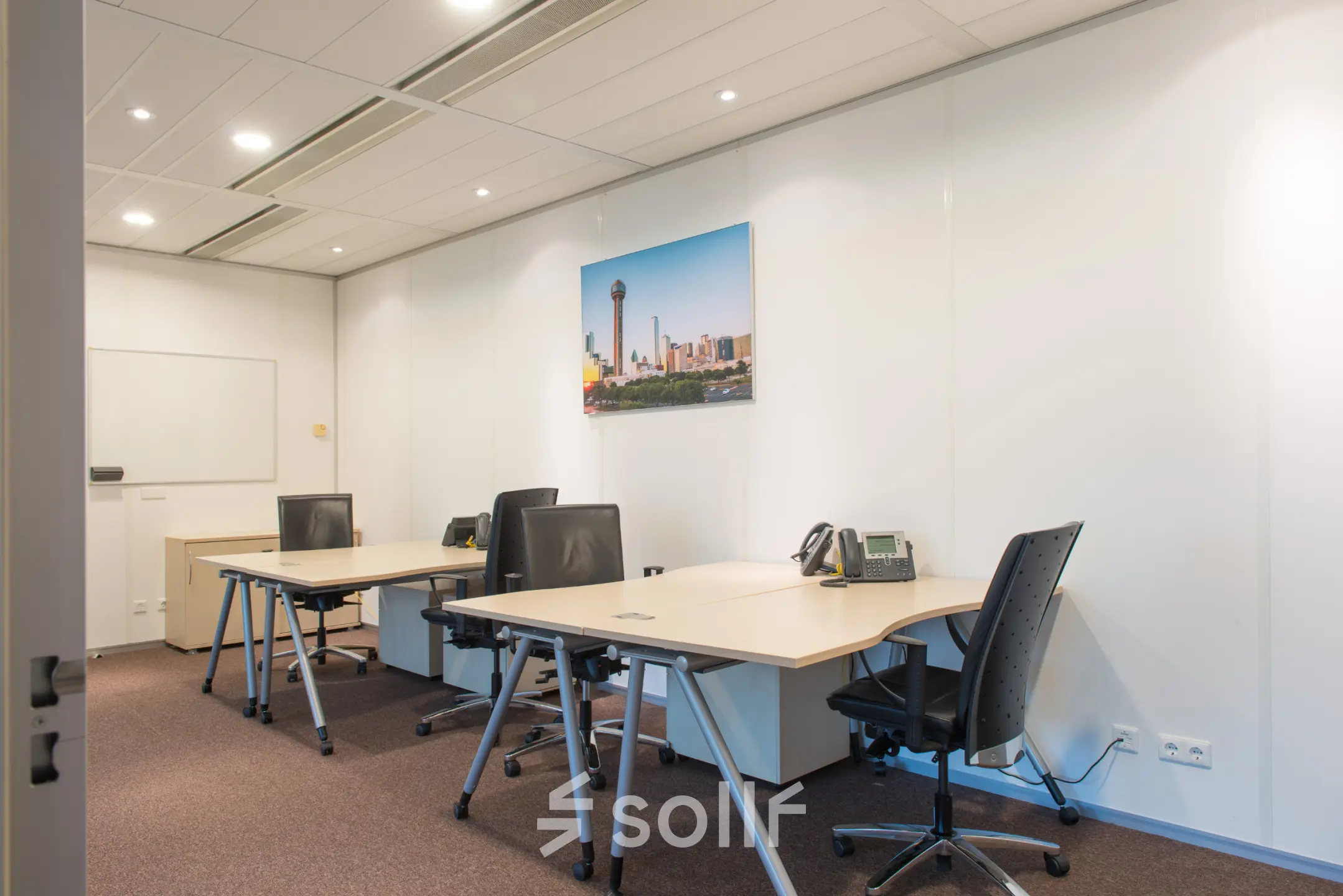 Furnished office space with desks and chairs for rent at Carrer de la Marina 16-18, Barcelona Sant Martí, ideal for business activities.