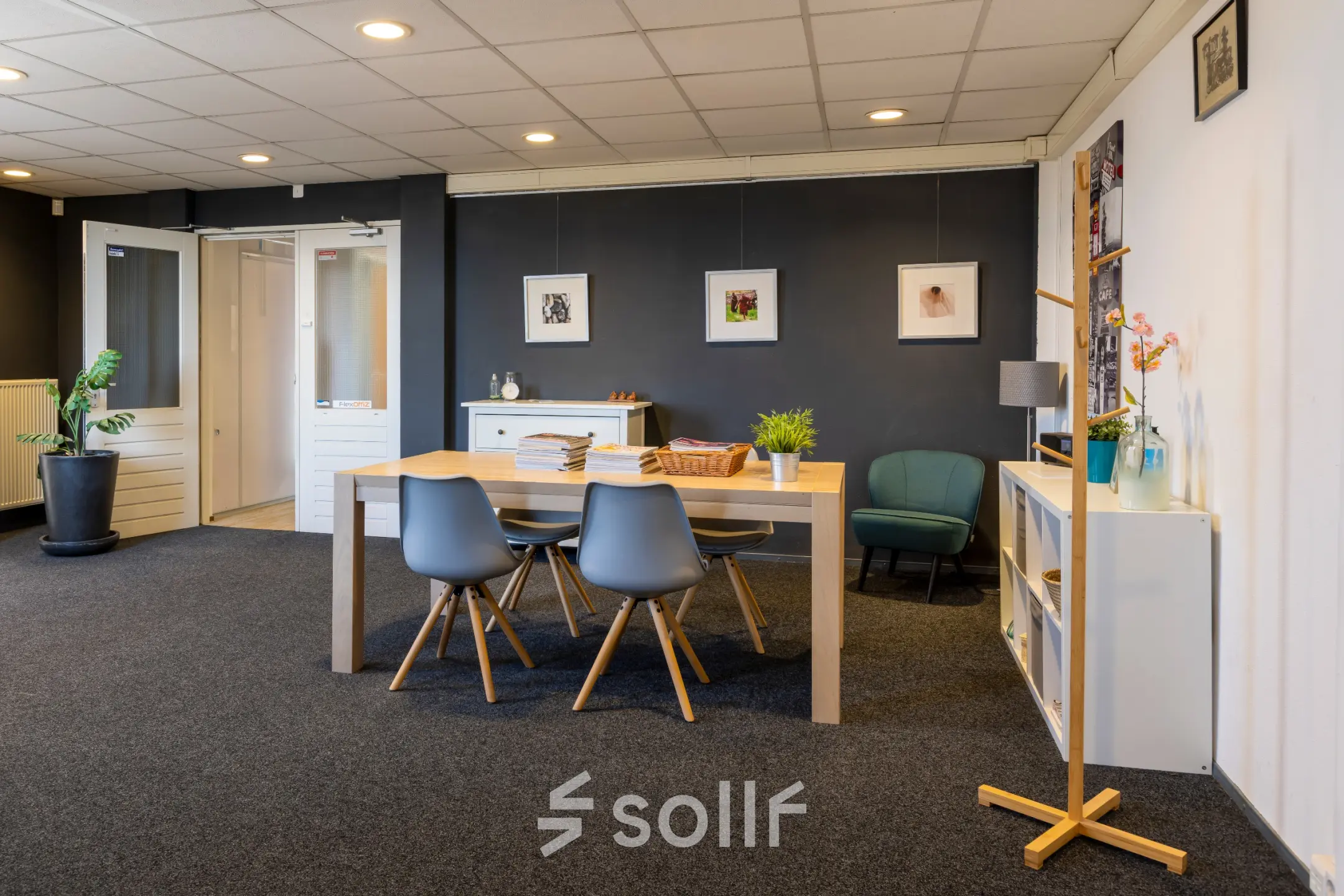 Inviting office space at Kamerlingh Onnesweg 10, Barendrecht, featuring a modern table with chairs, wall art, and a cozy seating area, ideal for rent office space needs.