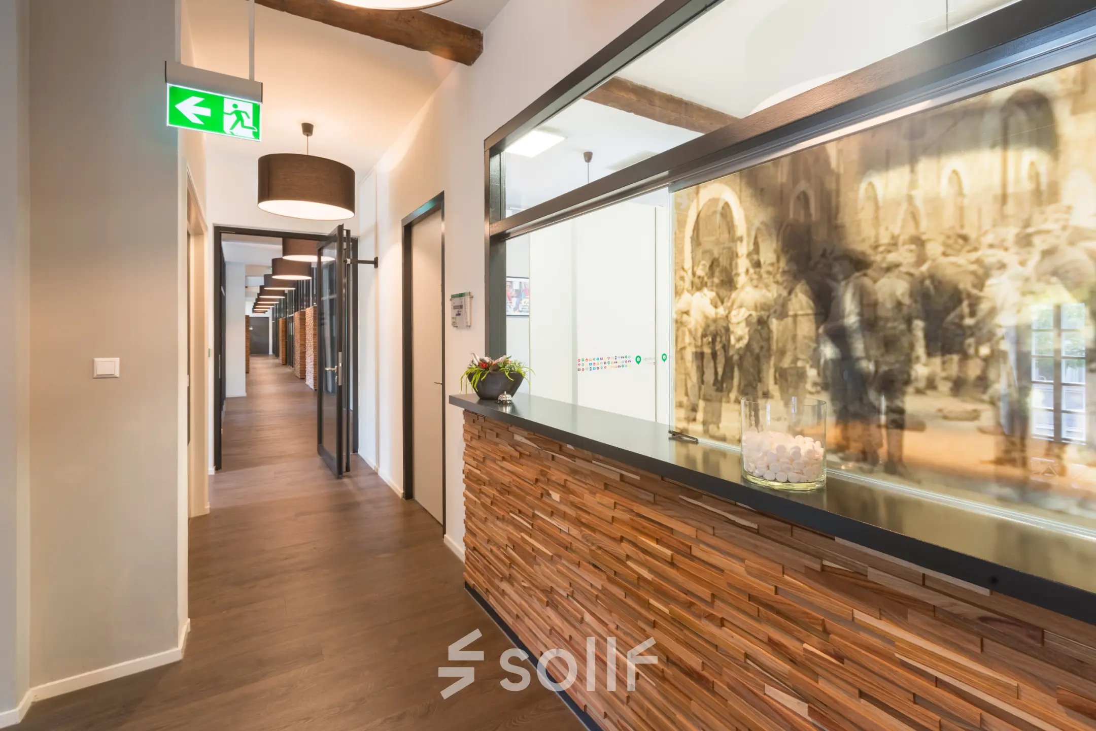 Furnished office reception area at Blokstallen 2B, Bergen op Zoom, ideal for office space rental with warm lighting and wooden accents.