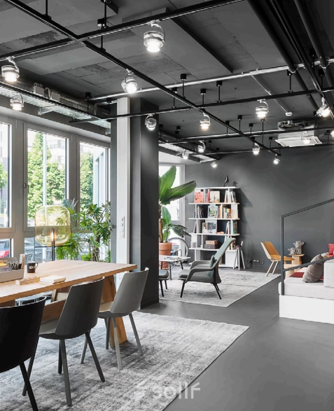 Modern, well-lit office interior at Koppenstraße 93, Berlin Friedrichshain, featuring stylish furnishings and sleek design elements, perfect for office space rental.