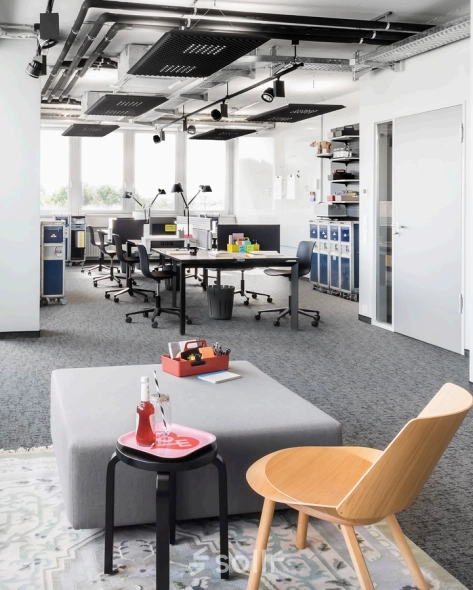 Modern office space in Berlin Friedrichshain with workstations and windows, perfect for office space rental.