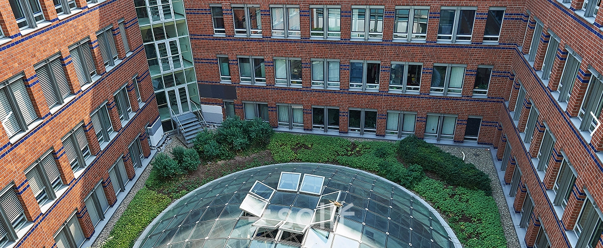 Exterior view of Koppenstraße 93 in Berlin Friedrichshain, showcasing a modern office building available for rent.