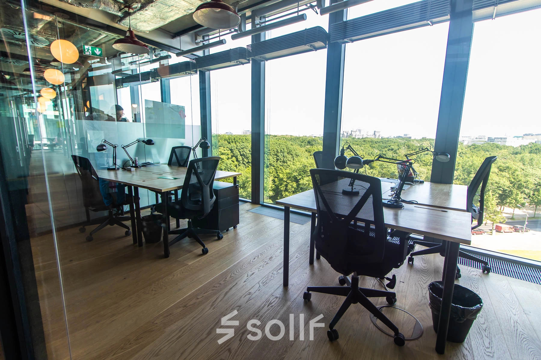 Modern office space rental at Warschauer Platz 11-13, Berlin Friedrichshain, featuring workstations with a stunning view. Ideal for businesses seeking an office to rent.