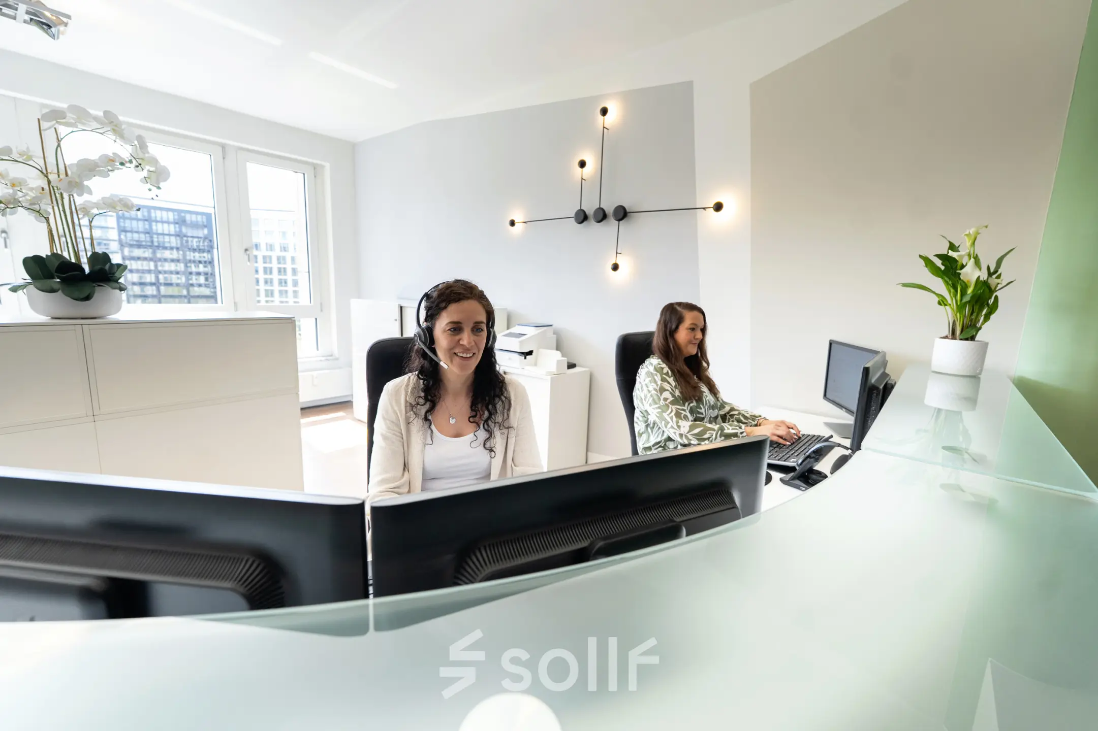 Bright office space at Leipziger Platz 15, Berlin Mitte, featuring modern decor with professionals working at desks.