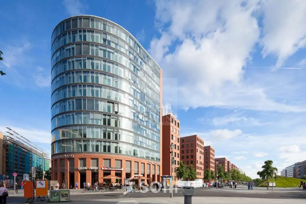 Office building with a modern curved glass facade at Potsdamer Platz 10, perfect for those seeking office space rental in Berlin Mitte.