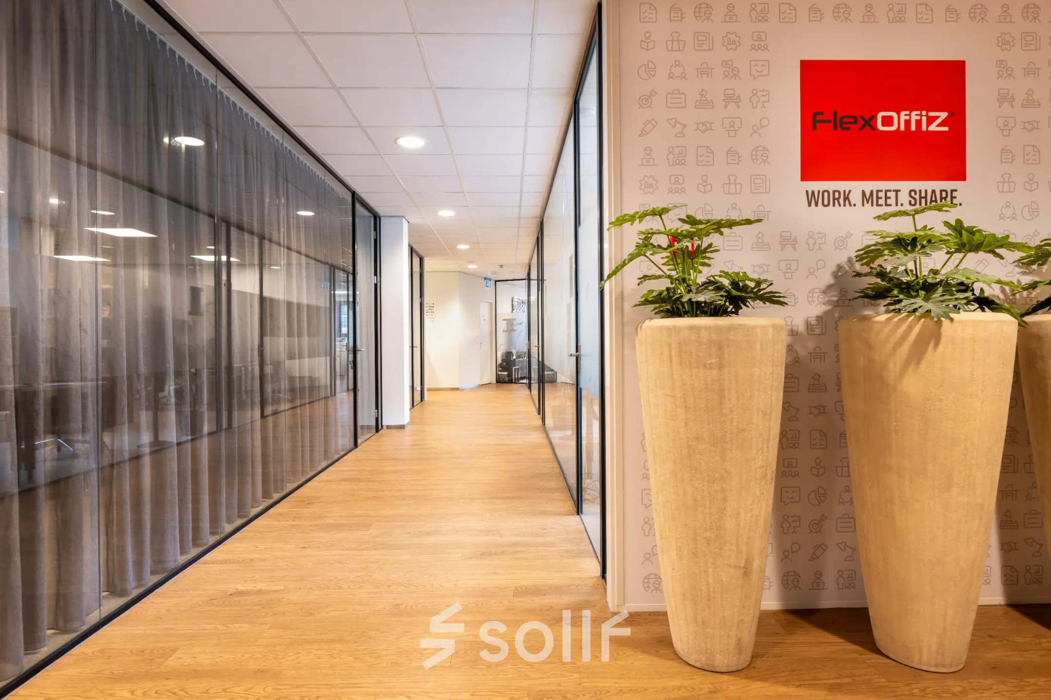 Modern office space in Bodegraven at Marktstraat 1-7 with stylish decor, featuring large planters and glass partitions, available for rent.