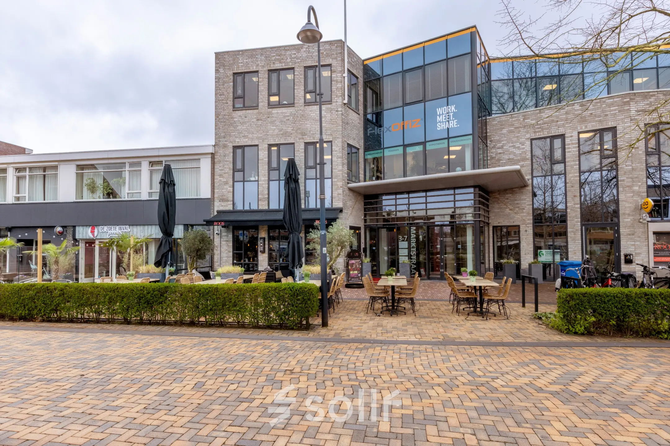 Exterior view of office building at Marktstraat 1-7, Bodegraven, showcasing potential office space rental opportunities.