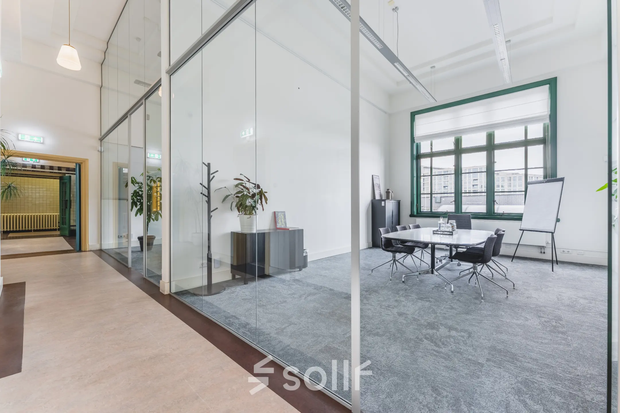 Bright office space to rent at Ceresstraat 13, Breda Centrum-Station, featuring glass walls, a conference table, and chairs, suitable for office space rental.