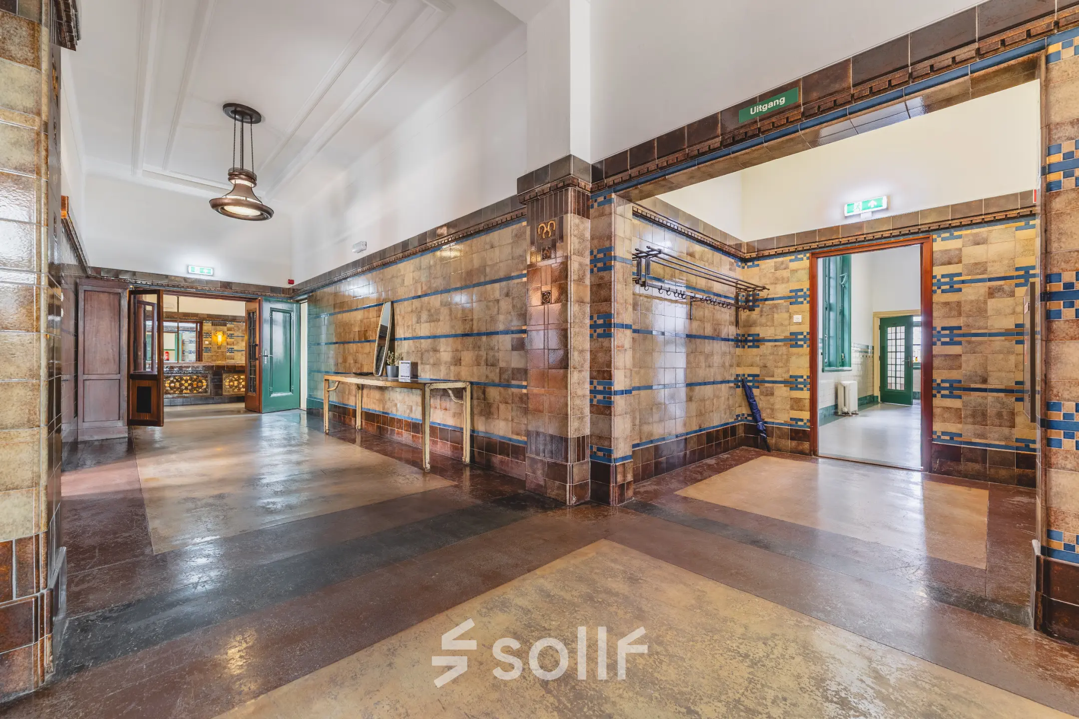 Interior view of an office space at Ceresstraat 13, Breda Centrum-Station, showcasing a tiled hallway with visible doors leading to different rooms, offering potential for office space rental.