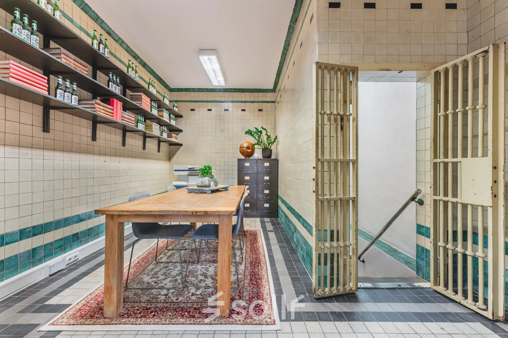 Furnished office space at Ceresstraat 13 in Breda Centrum-Station with wooden desk, shelves, and decorative items. An ideal spot for office space rental with a vintage look.