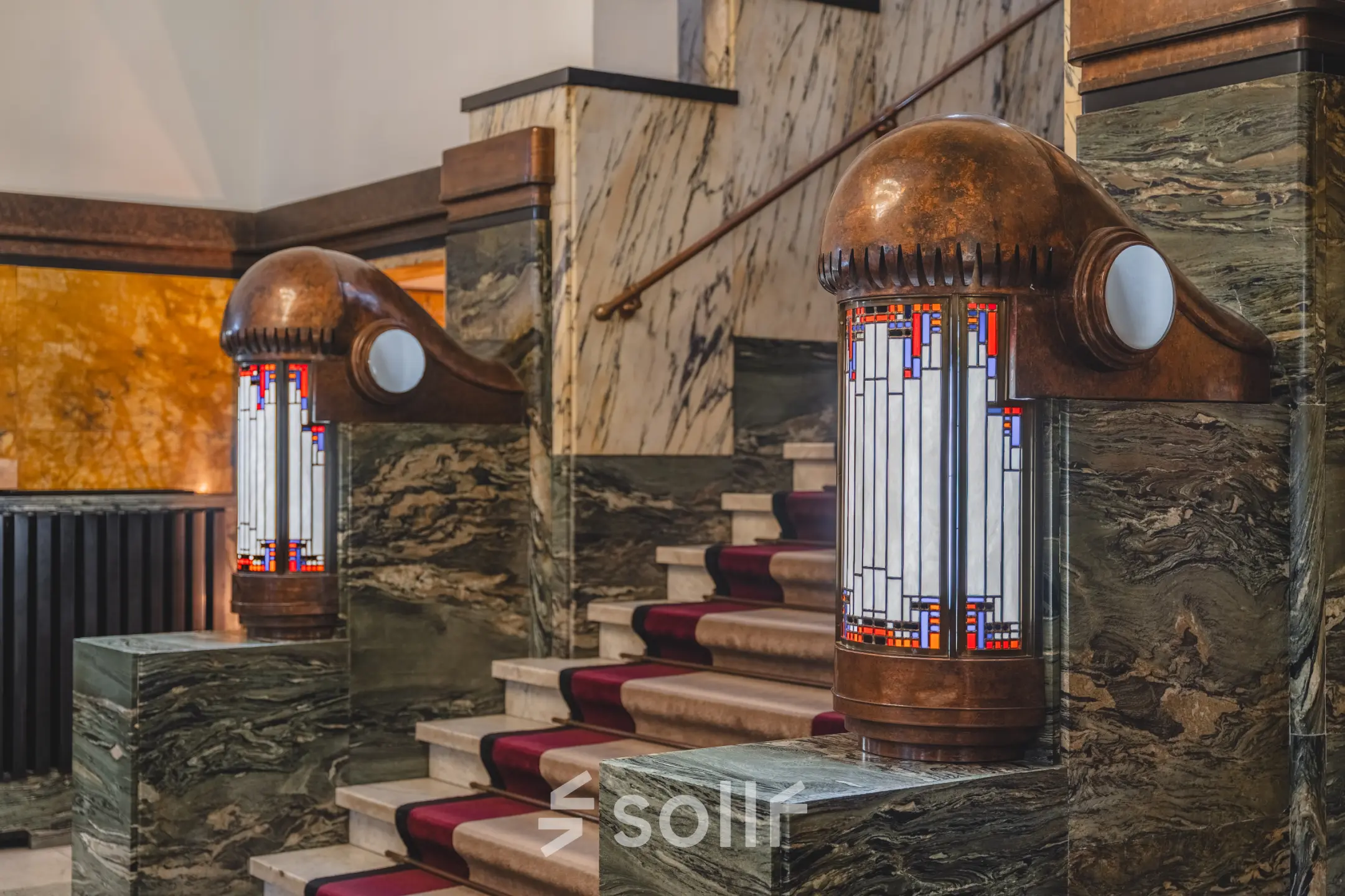 Interior view of an office at Ceresstraat 13, featuring a stylish stairway with decorative lighting, ideal for office space rental.