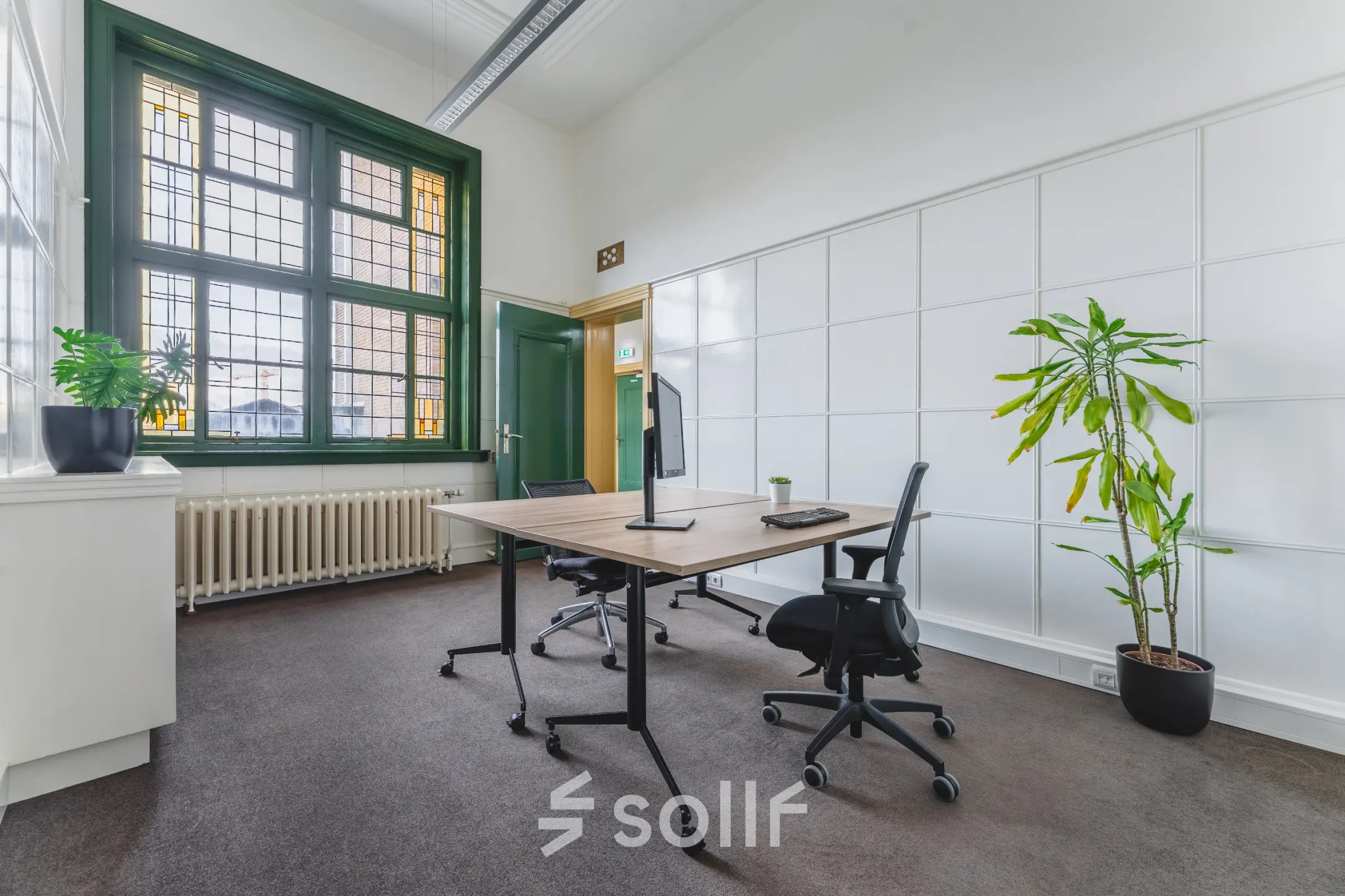 Bright office space at Ceresstraat 13, Breda Centrum-Station, featuring a large window and minimal furnishings, ideal for rent office space seekers.
