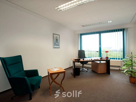 Office space at Flughafenallee 26, Bremen Neustadt, featuring a desk, chair, table, and a plant, ideal for rent office space seekers.