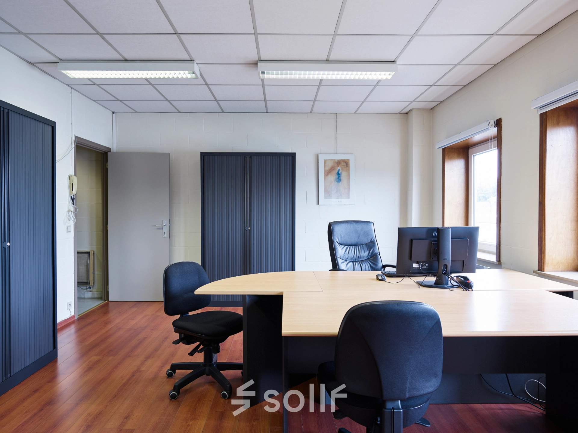 Furnished office to rent at Leuvensesteenweg 613, Brussels Airport, featuring a desk, chairs, and office equipment, ideal for office space rental needs.