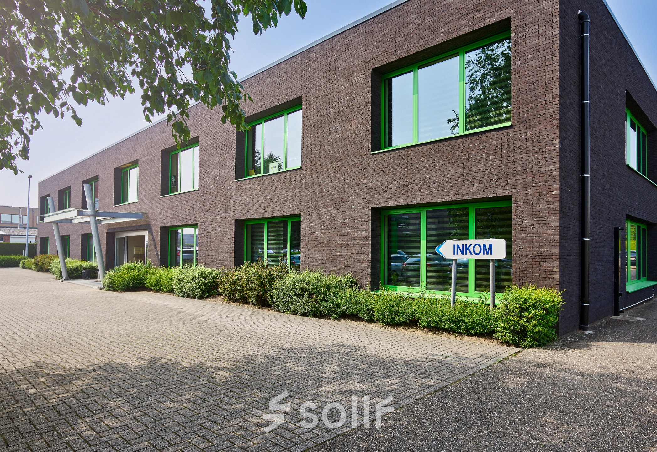Exterior view of a modern office building located at Leuvensesteenweg 613, ideal for office space rental.