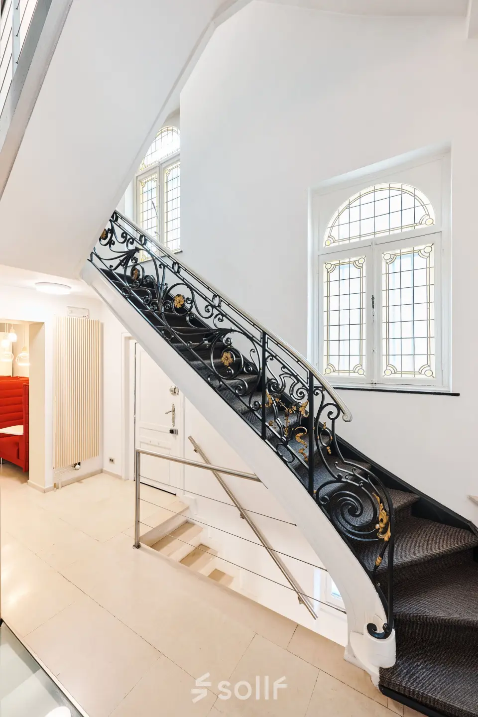 Elegant office staircase with decorative railing located at Rue du Congres 37 in Brussels Center, ideal for office space rental.