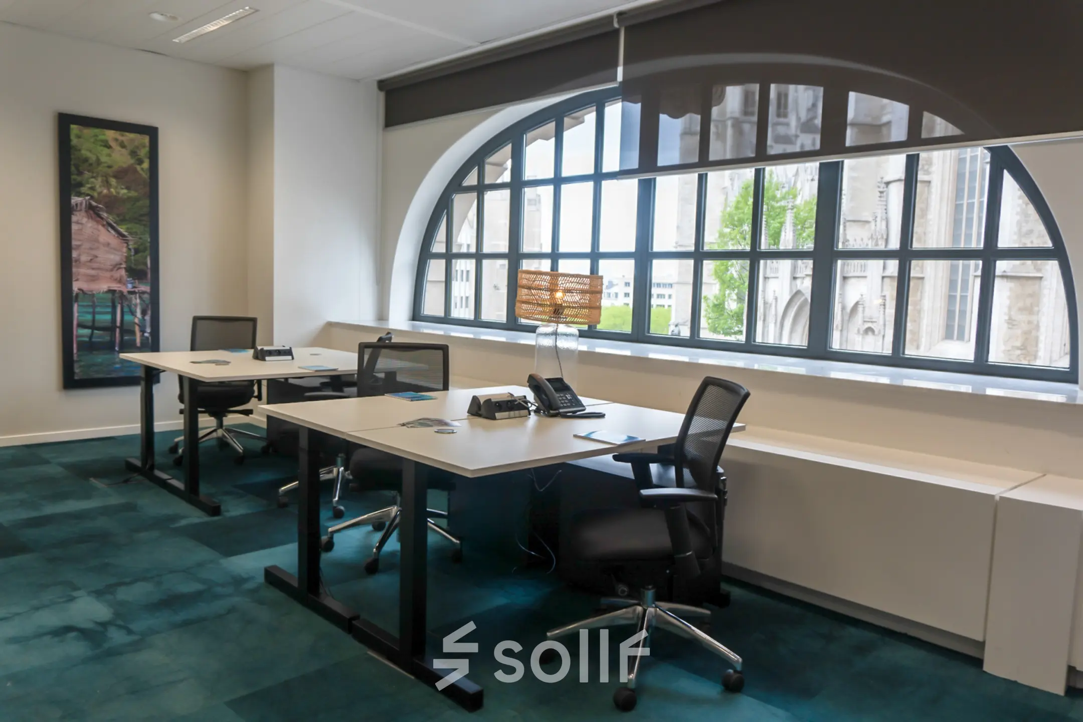 Modern office space rental with large windows and desks located at Rue des Colonies 56, Brussels European District.