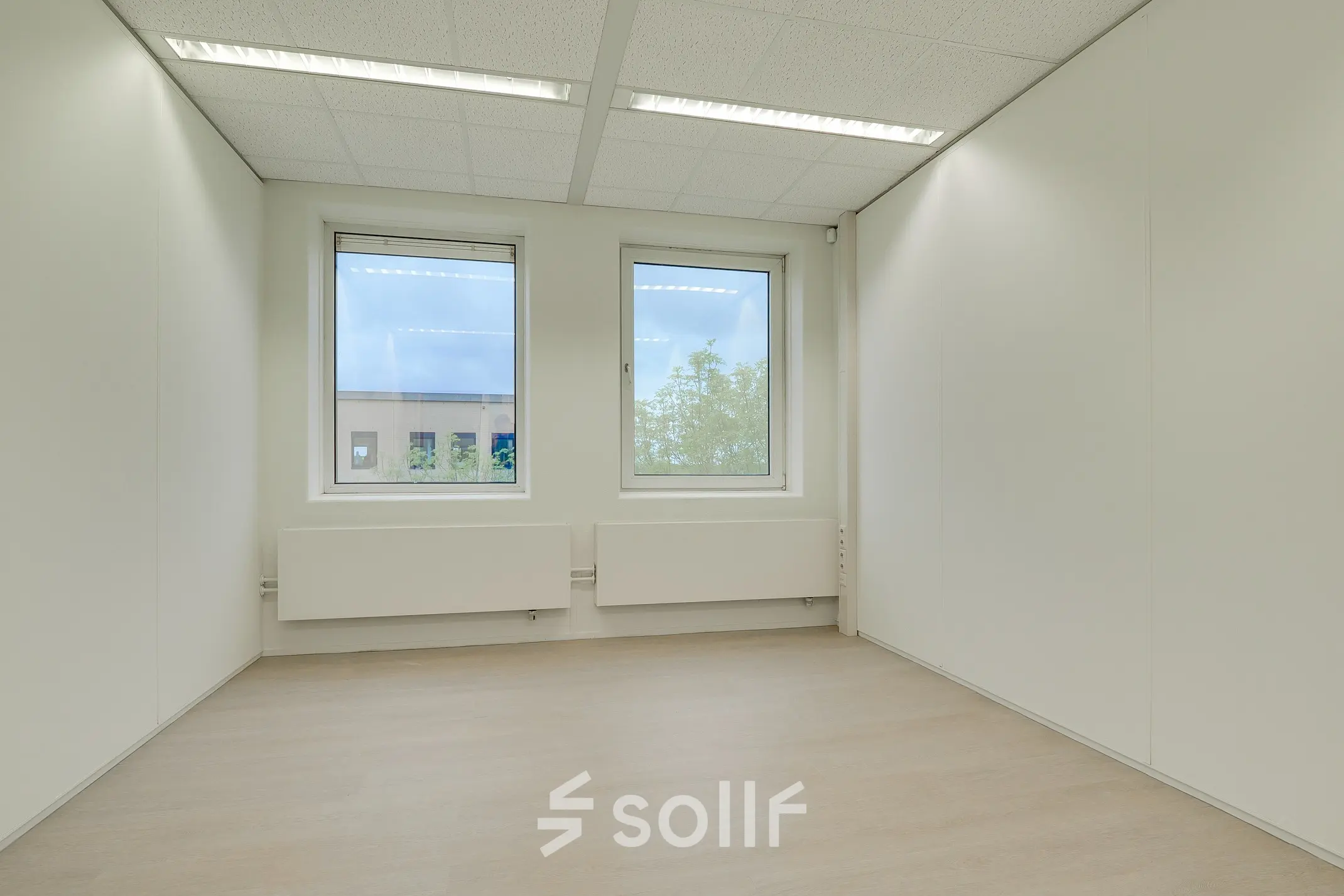 Unfurnished office space with large windows at Regulierenring 2, Bunnik, ideal for office space rental.