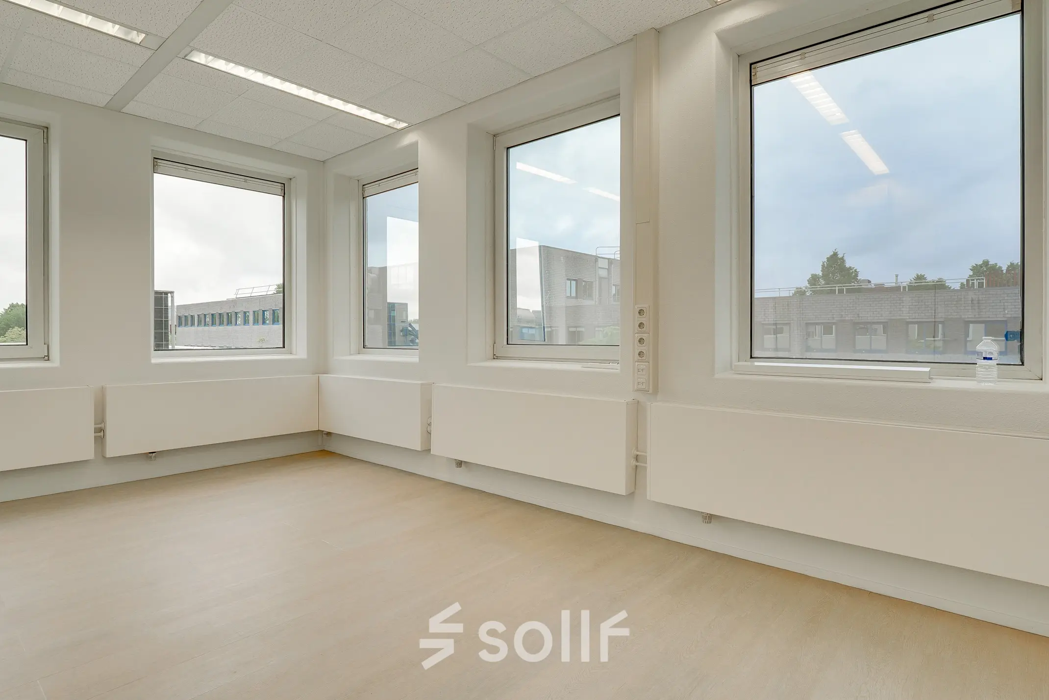 Bright office space with large windows and light wooden flooring, available to rent at Regulierenring 2, Bunnik.