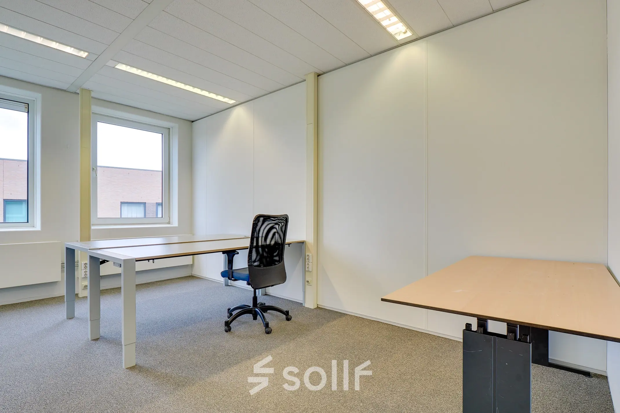 Bright office space to rent at Regulierenring 2, Bunnik, featuring multiple desks and ample natural light.