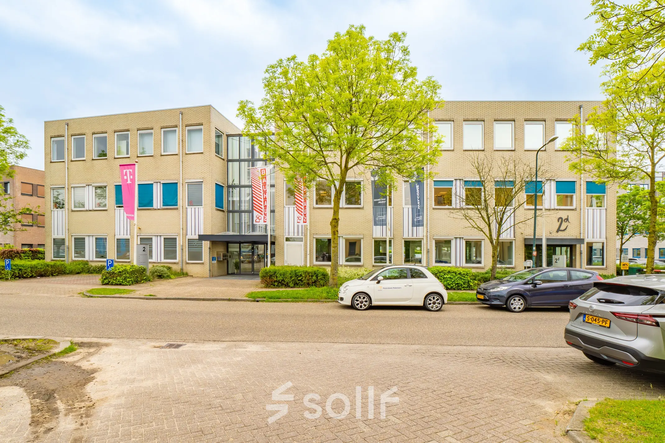 Exterior view of an office building at Regulierenring 2, Bunnik, showcasing office space rental availability.