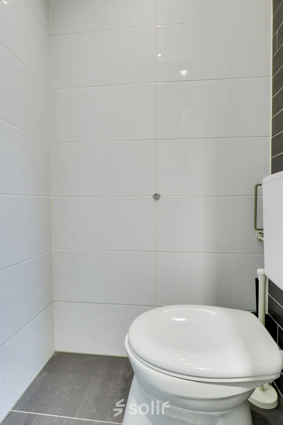Simple restroom in an office space at Regulierenring 2, Bunnik available for rent.