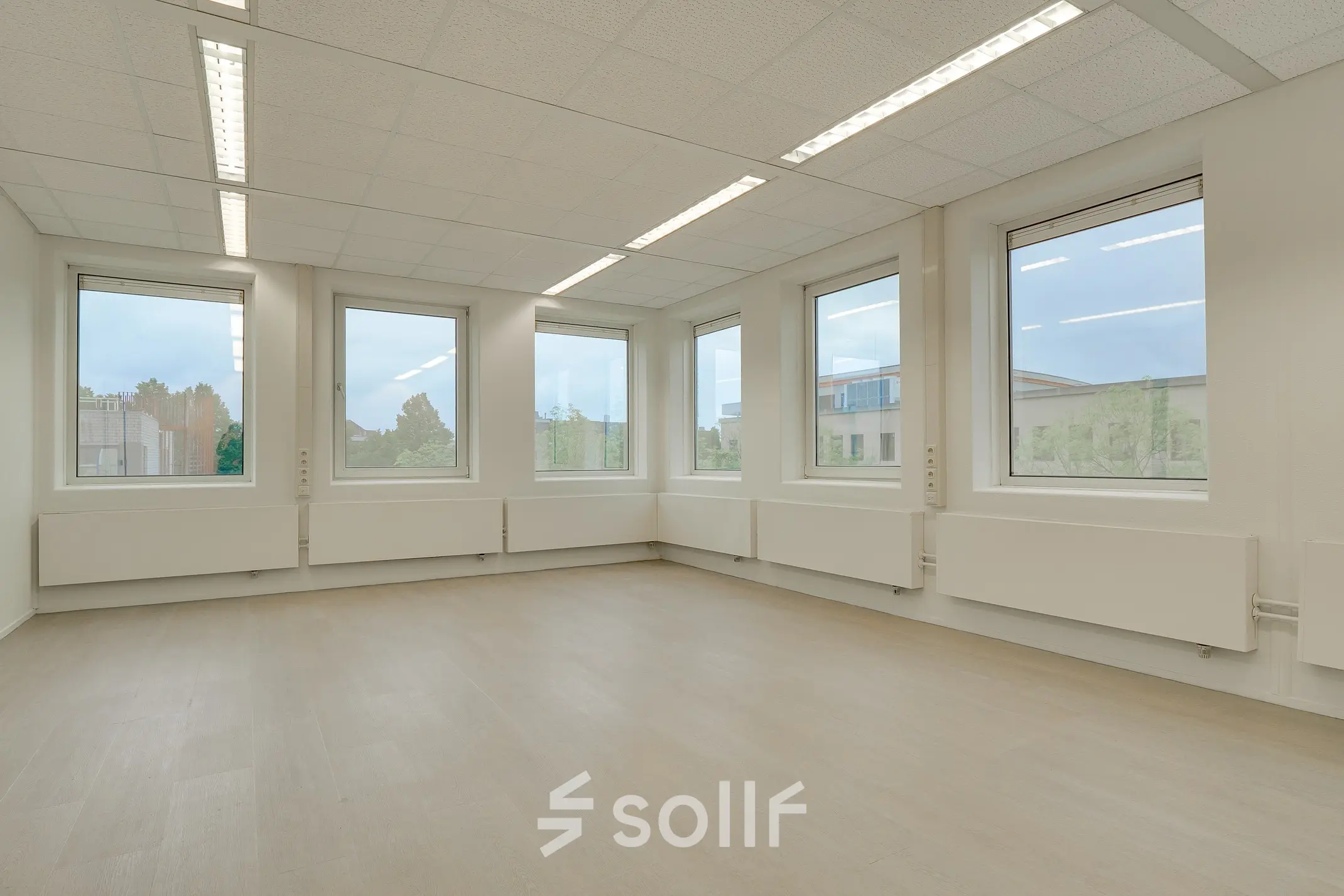 Bright, spacious office space with large windows at Regulierenring 2, ideal for rent office space in Bunnik.