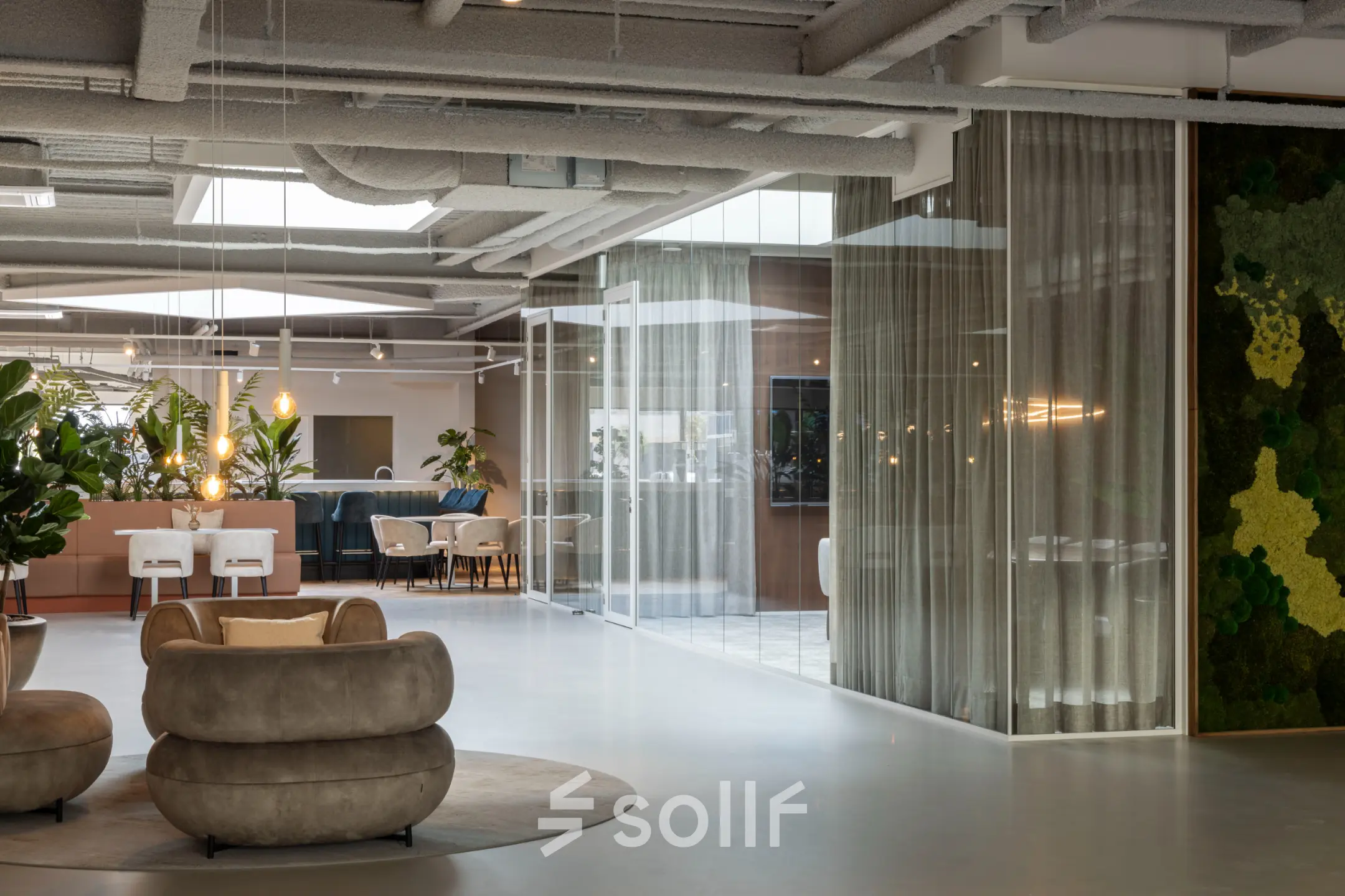 Modern furnished office interior at Essebaan 63, Capelle aan den IJssel. Features stylish seating and plants, ideal for workspaces. Consider this office space rental for a contemporary work environment.