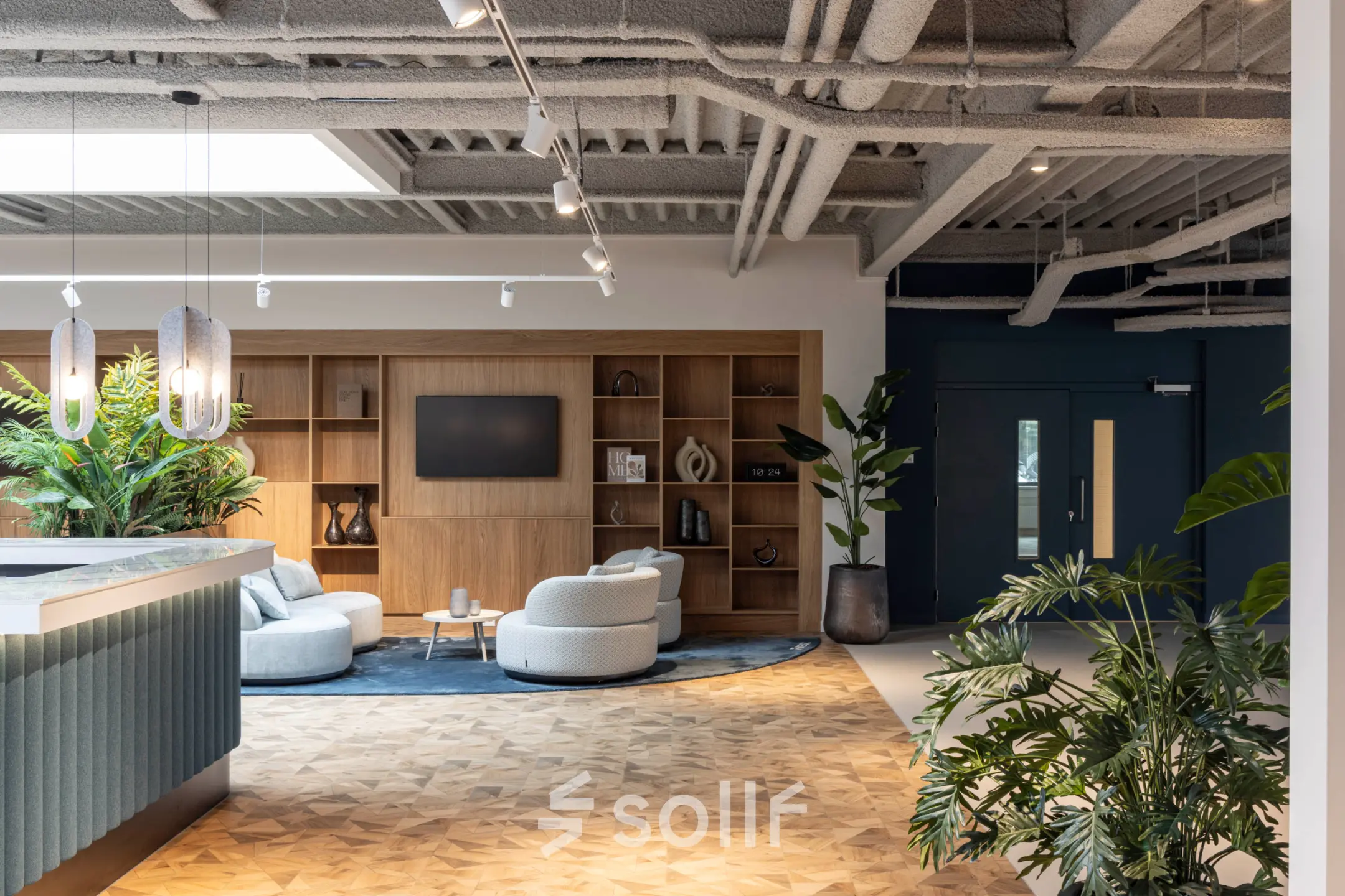 Modern furnished office space rental at Essebaan 63, Capelle aan den IJssel, featuring a stylish lounge area with contemporary seating and decorative elements.