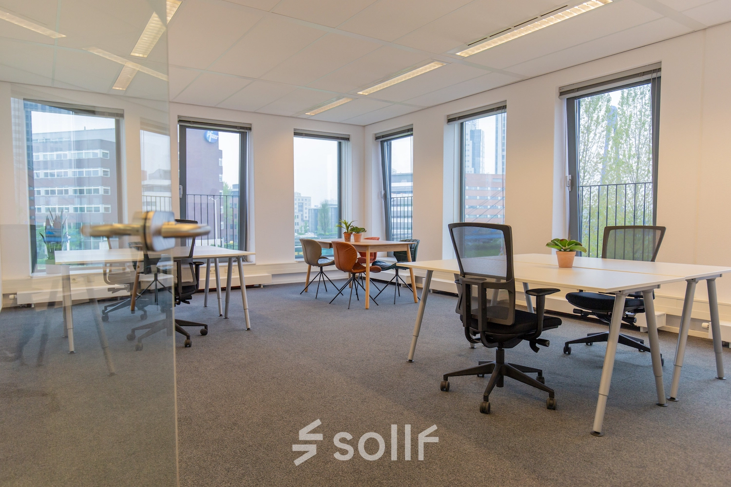 Spacious office with multiple desks and chairs, natural light from large windows, available for office space rental at Fascinatio Boulevard 562, Capelle aan den IJssel.