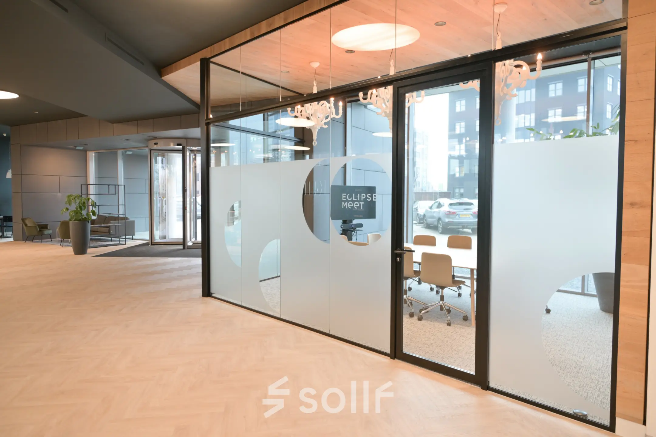 Modern conference room available for office space rental at Rivium Quadrant 75, Capelle aan den IJssel, featuring large glass doors and stylish lighting.