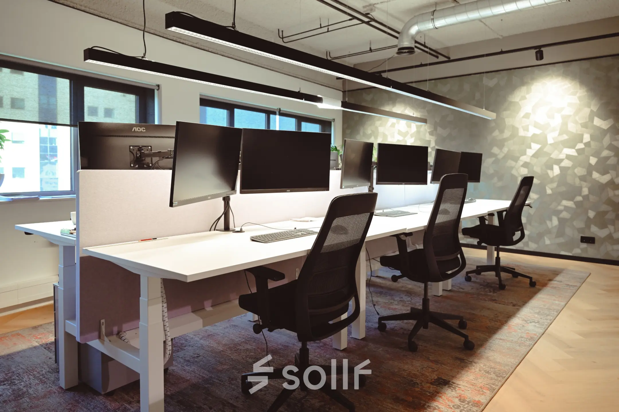 Modern office space at Rivium Quadrant 75, Capelle aan den IJssel, featuring multiple workstations with computers and ergonomic chairs ideal for office space rental.