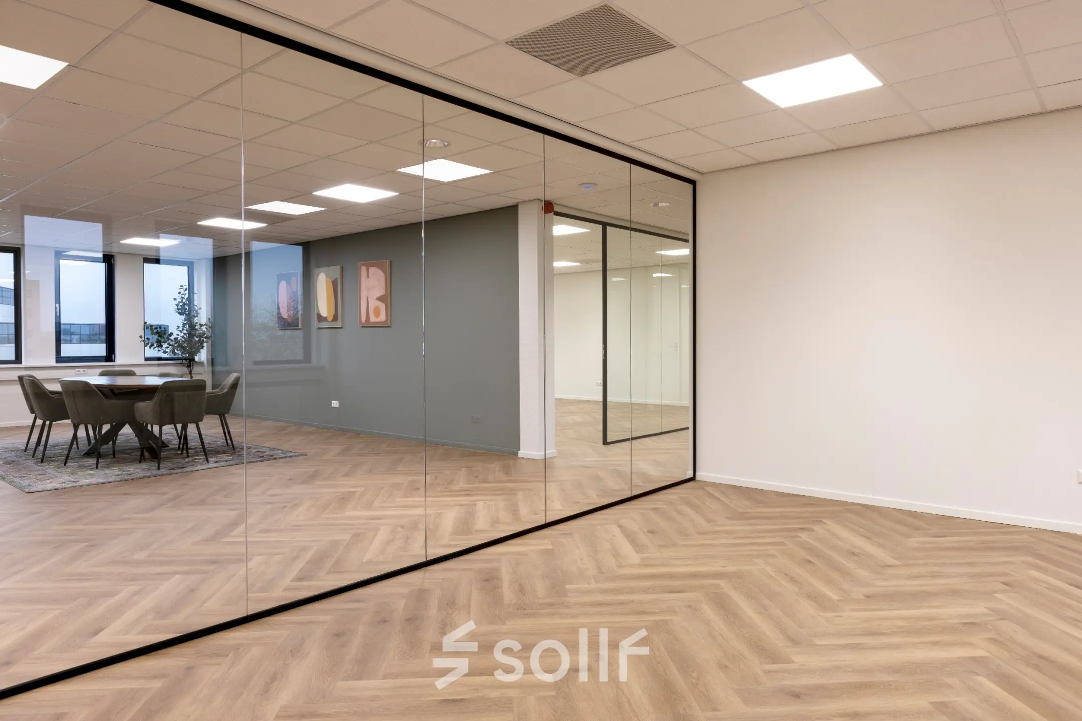 Modern office to rent at Vlierbaan 20, Capelle aan den IJssel, featuring glass walls and wooden flooring, ideal for office space rental.