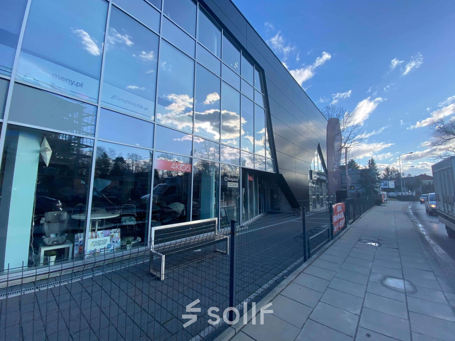 Exterior view of a modern office building at Marcika 27, Cracow Łagiewniki Borek Fałęcki, showcasing glass facades suitable for office space rental.