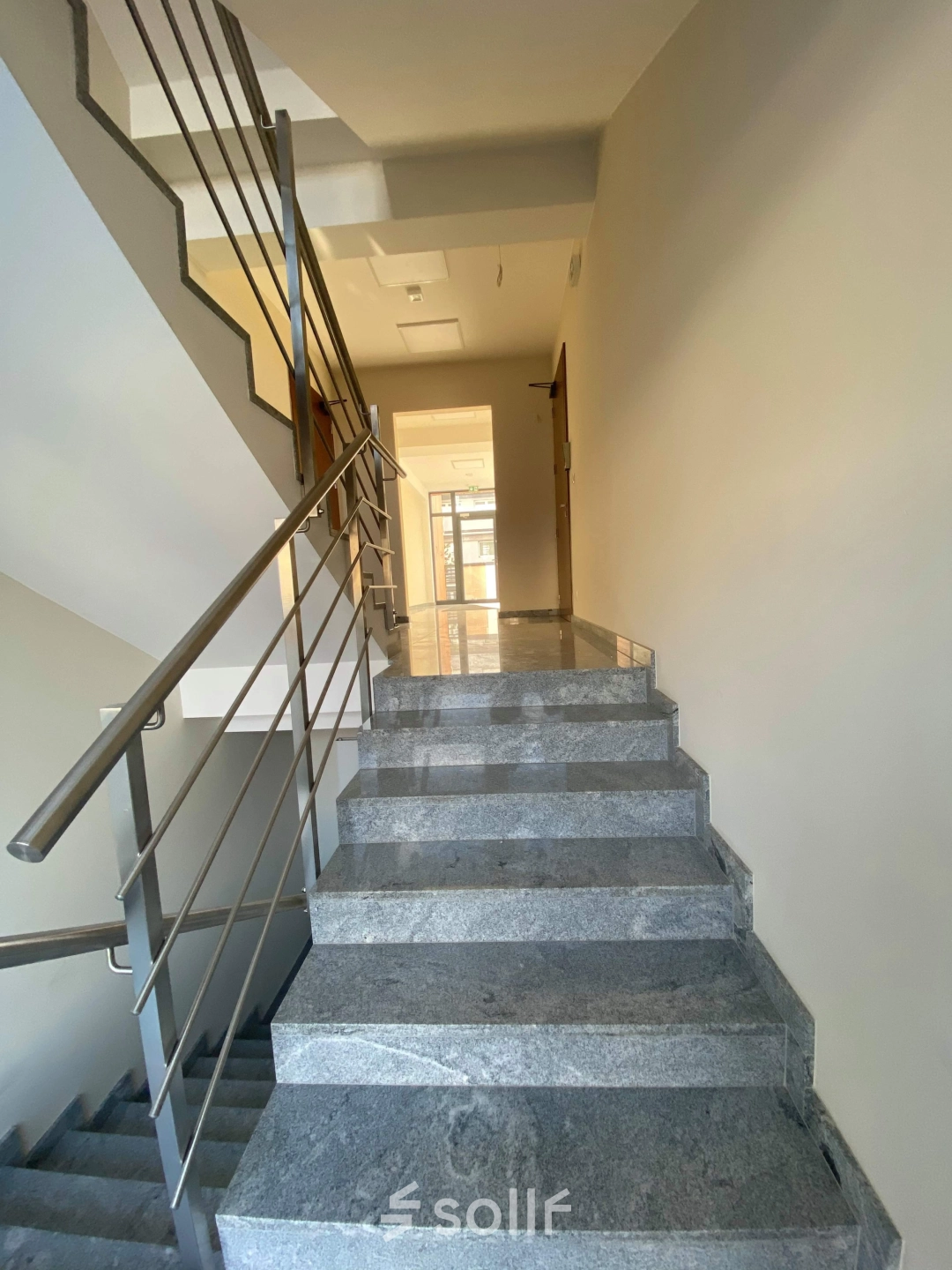 Staircase leading to office space rental at Jastrzębia 24, Cracow Podgorze Duchackie, highlighting clean interiors.