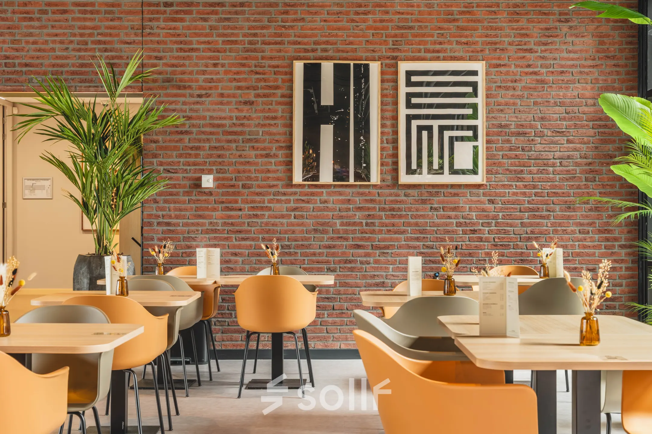 Furnished workspace at Rijnzathe 12 in De Meern featuring modern seating and tables, ideal for office space rental.