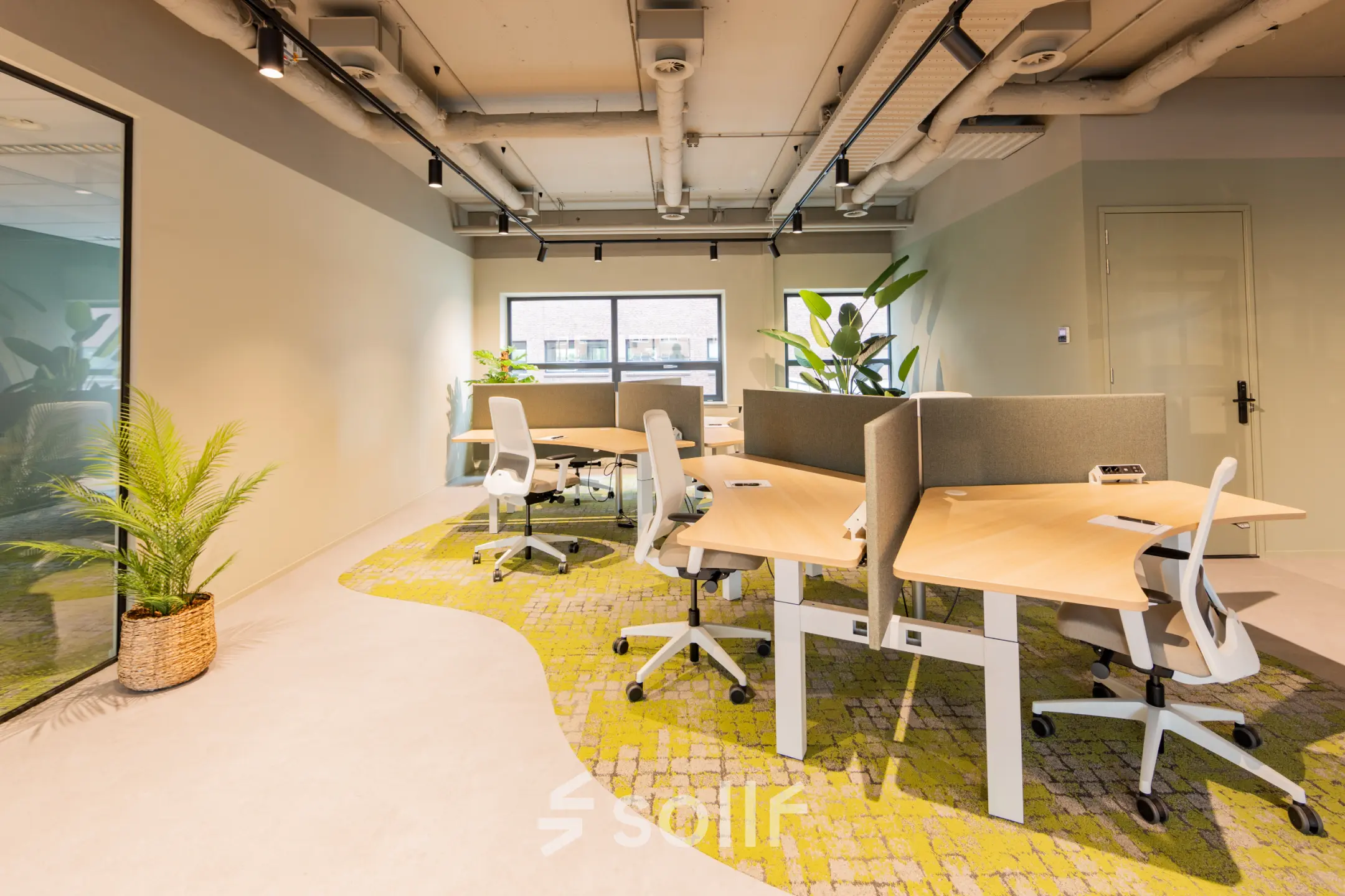Bright and modern workspace at Rijnzathe 12, De Meern, featuring desks and chairs ideal for office space rental.