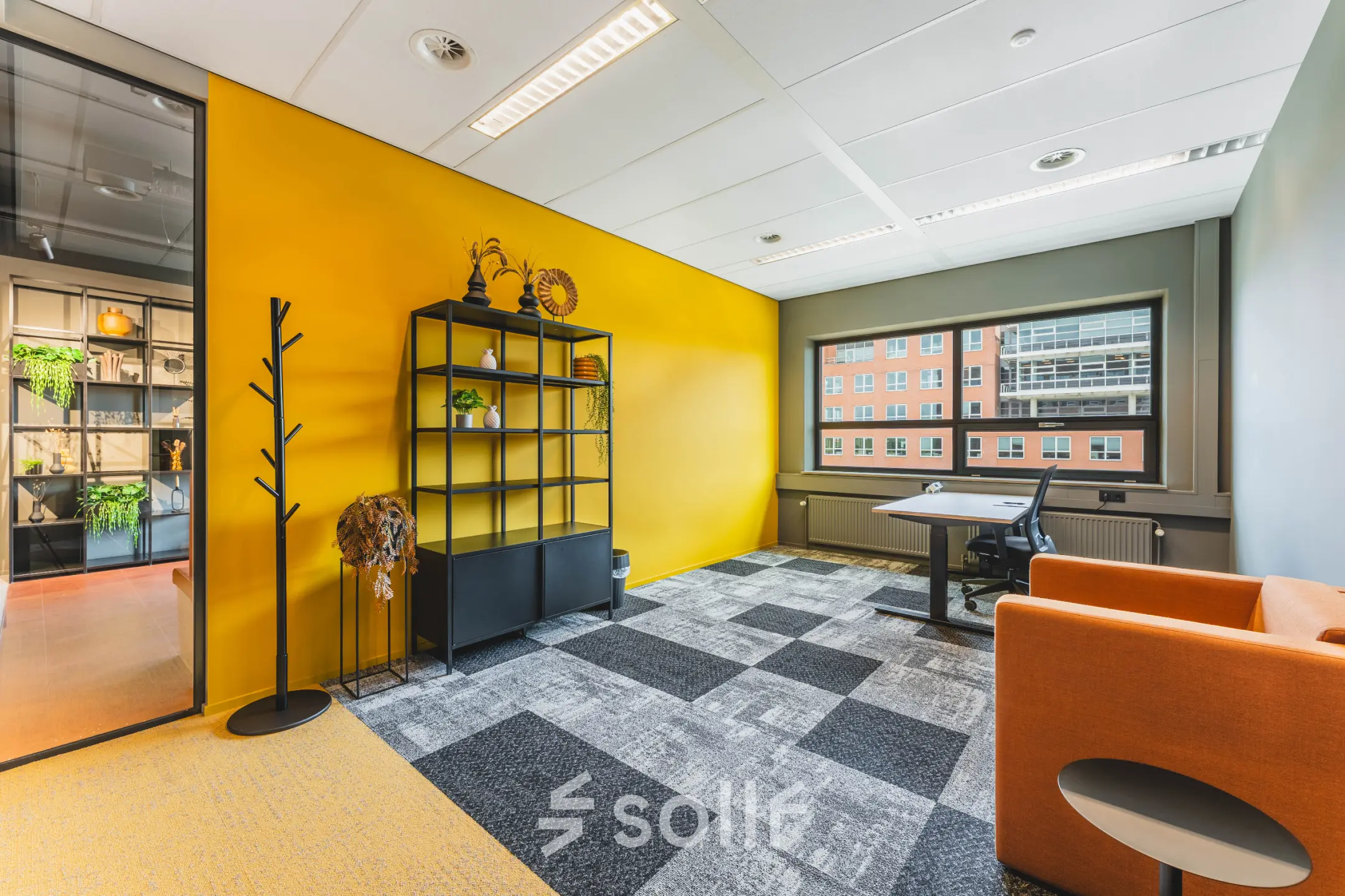 A modern furnished office space at Rijnzathe 12, De Meern, featuring bright walls, contemporary furniture, and ample natural light. Ideal for office space rental.