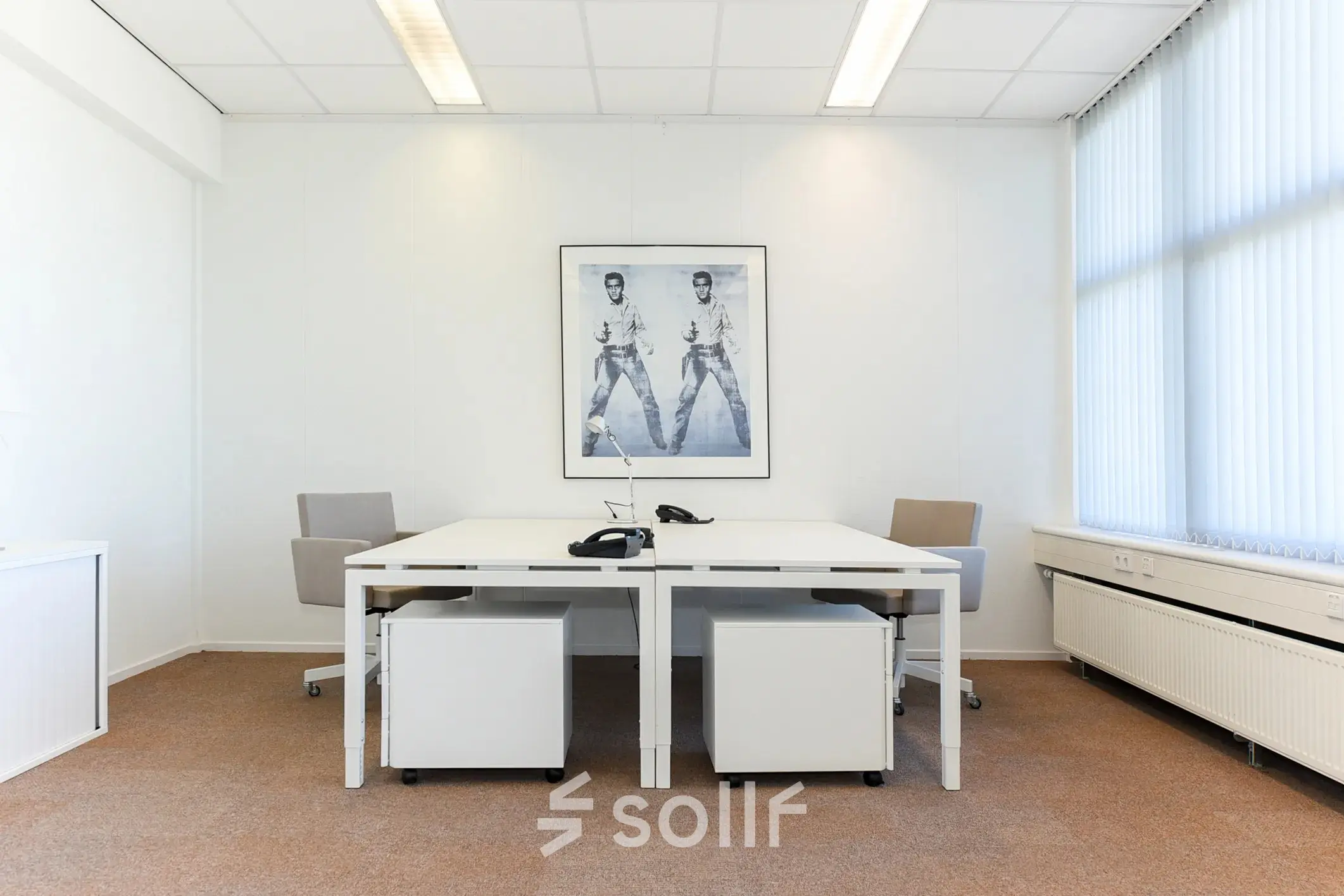 Bright office space with modern white desks and chairs at Marshalllaan 2, Delft. Ideal for rent office space with effective lighting and minimal decor.