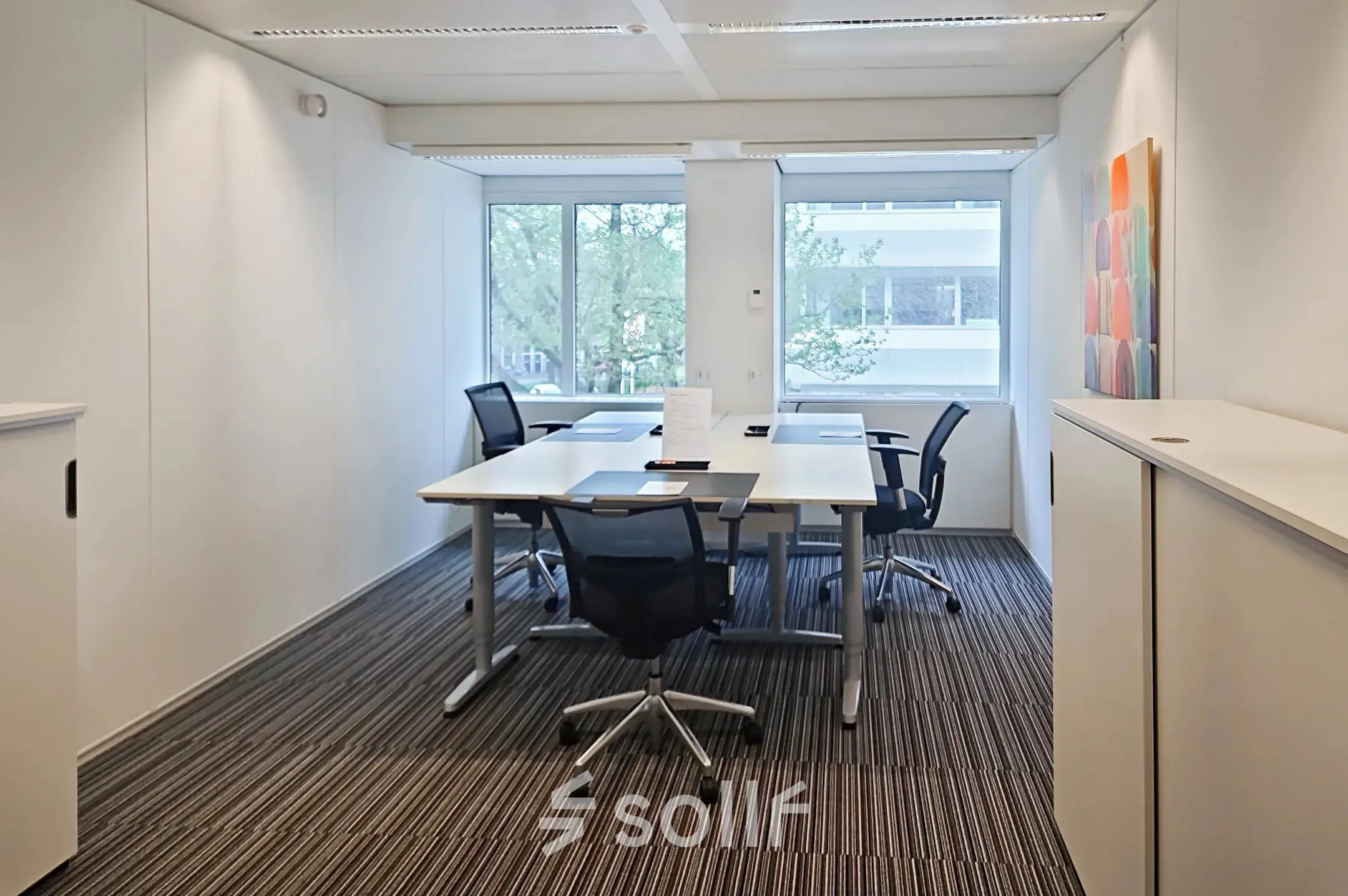 Office space at Poortweg 4, Delft, featuring a modern setup with desks and chairs, ideal for office space rental.