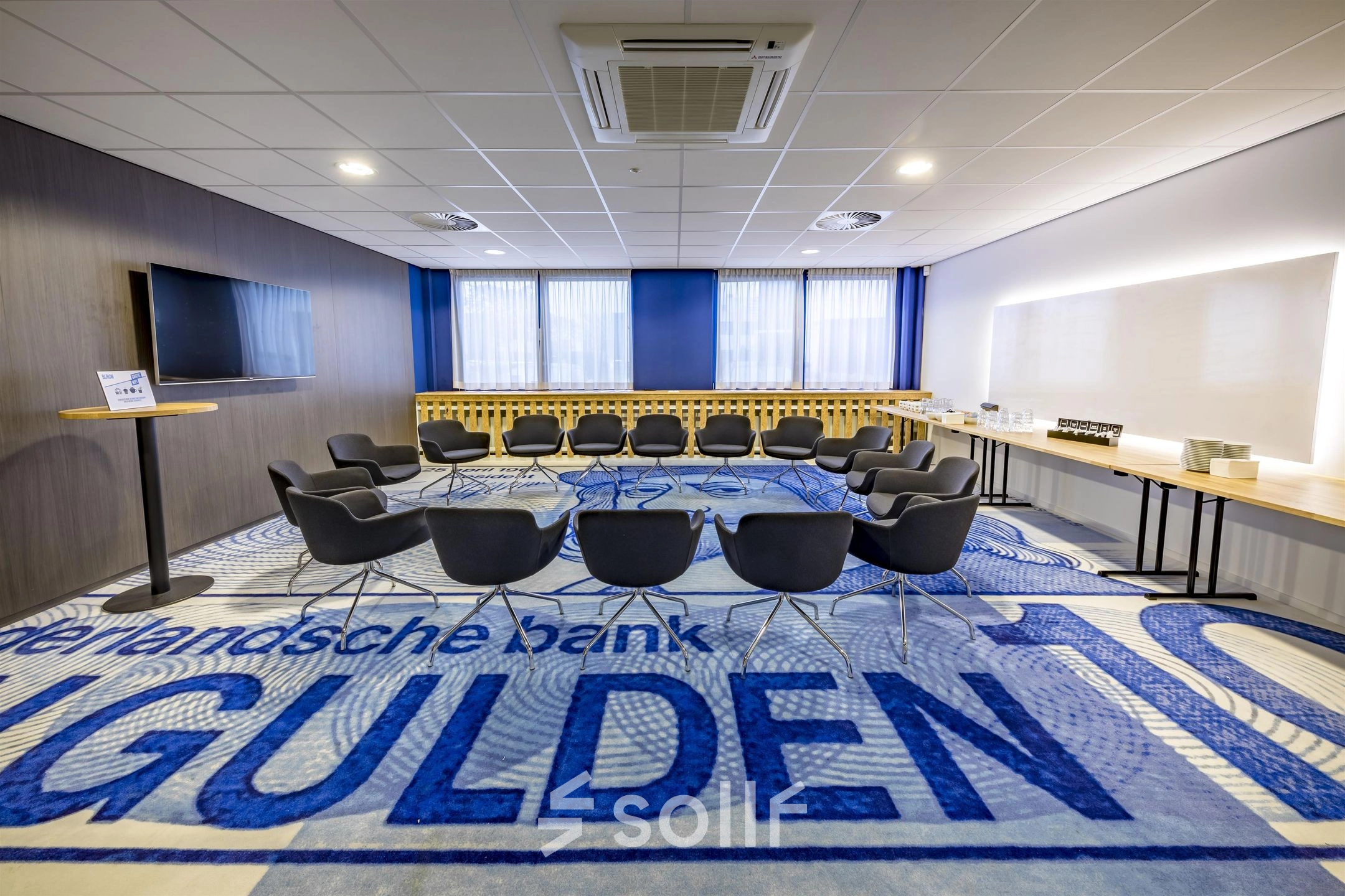 Office to rent at Amerikastraat 3, Den Bosch features a furnished conference room with a circular arrangement of chairs and tables for meetings. Ideal for office space rental.