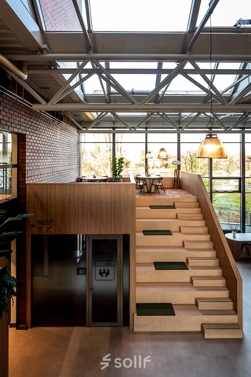 Modern, airy office at Hambakenwetering 5, Den Bosch with wooden staircase and large windows. Ideal for office space rental.