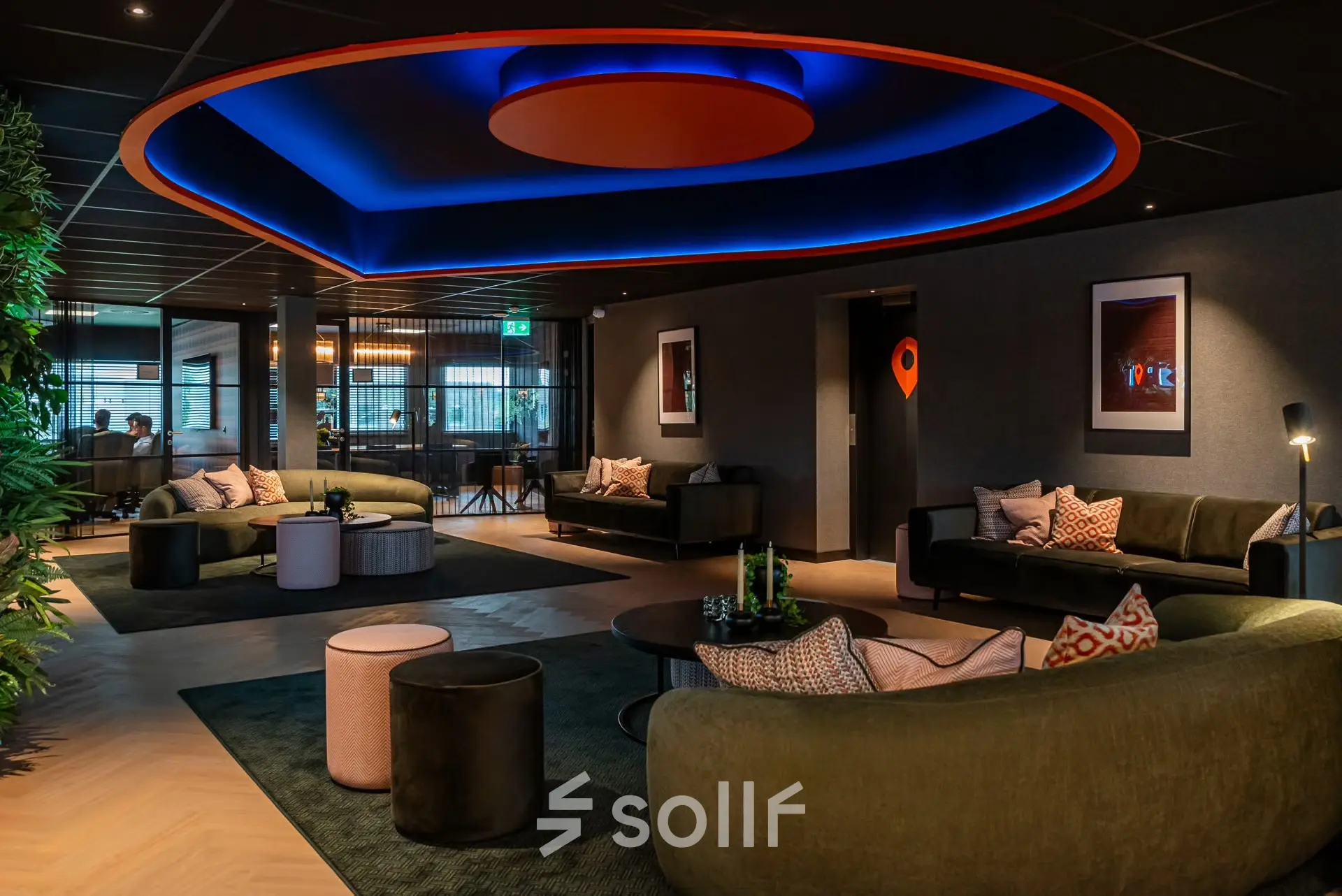 Spacious lounge area in an office to rent at Reitschweg 1, Den Bosch, featuring modern furniture and stylish decor ideal for relaxed business meetings.