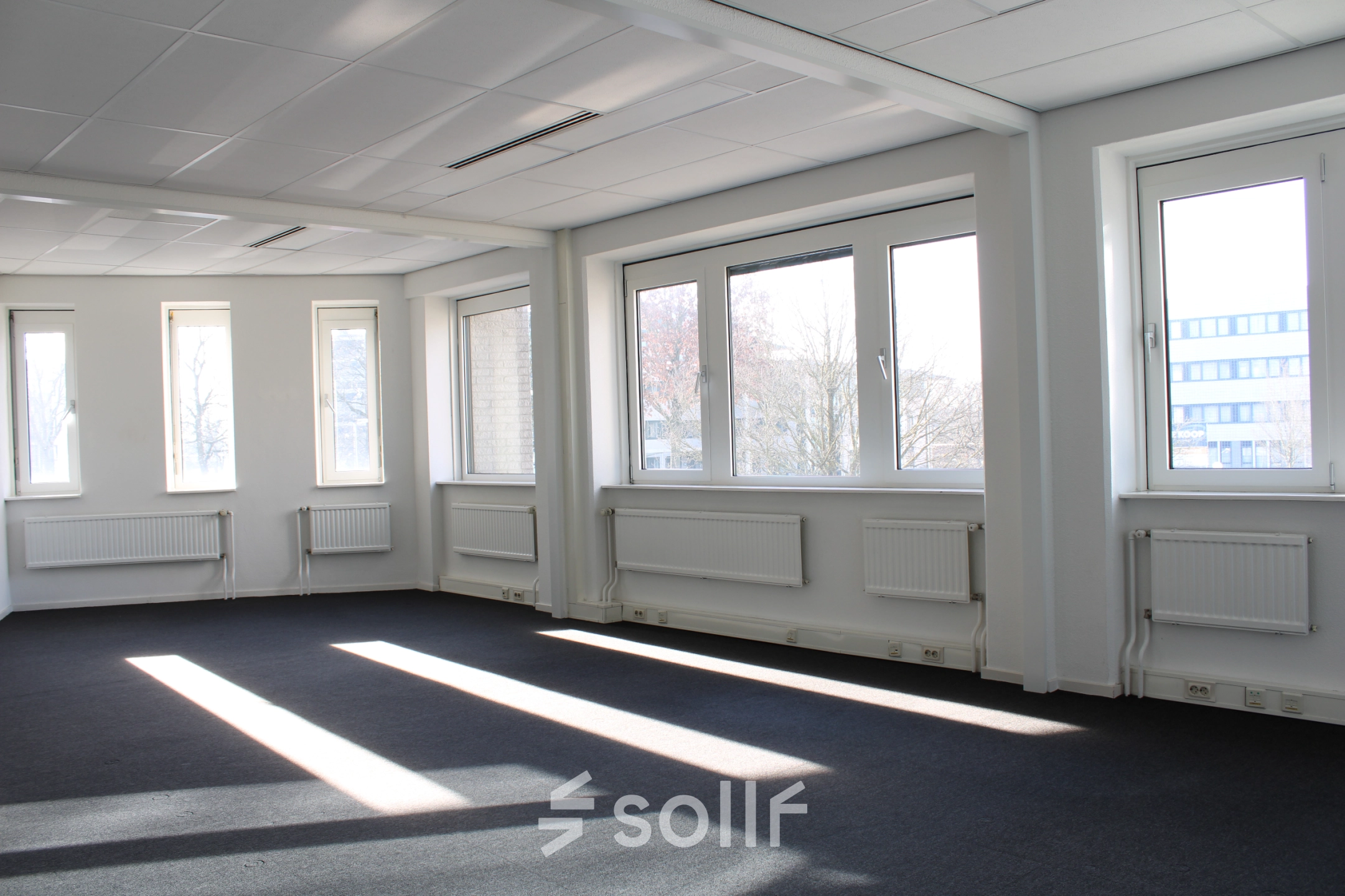 Bright office space rental with large windows at Keulenstraat 12, Deventer, offering a spacious layout for your next office to rent.