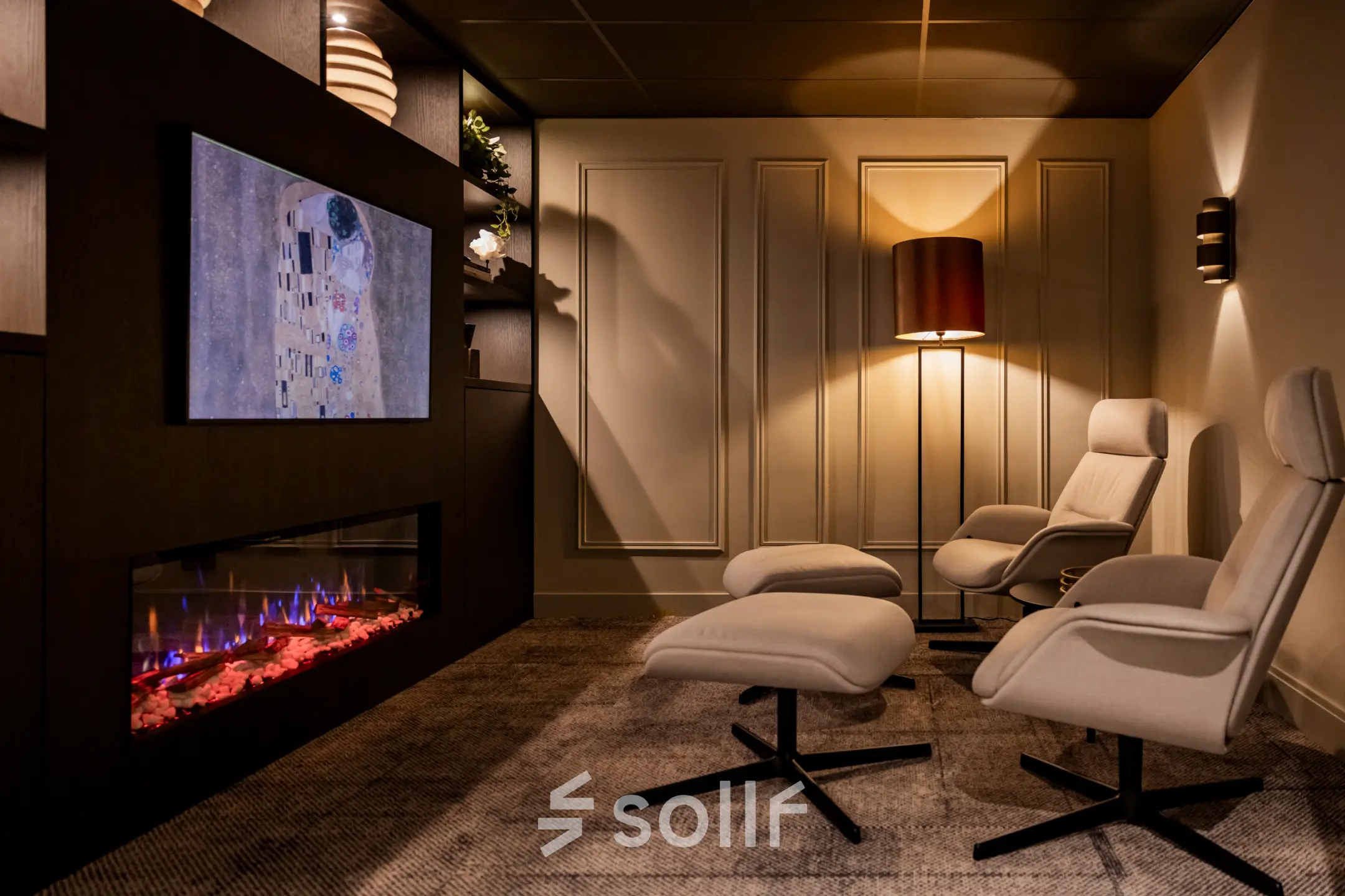 Cozy office space rental at Diemerhof 42, Diemen, featuring stylish chairs and a mounted TV with ambient lighting.