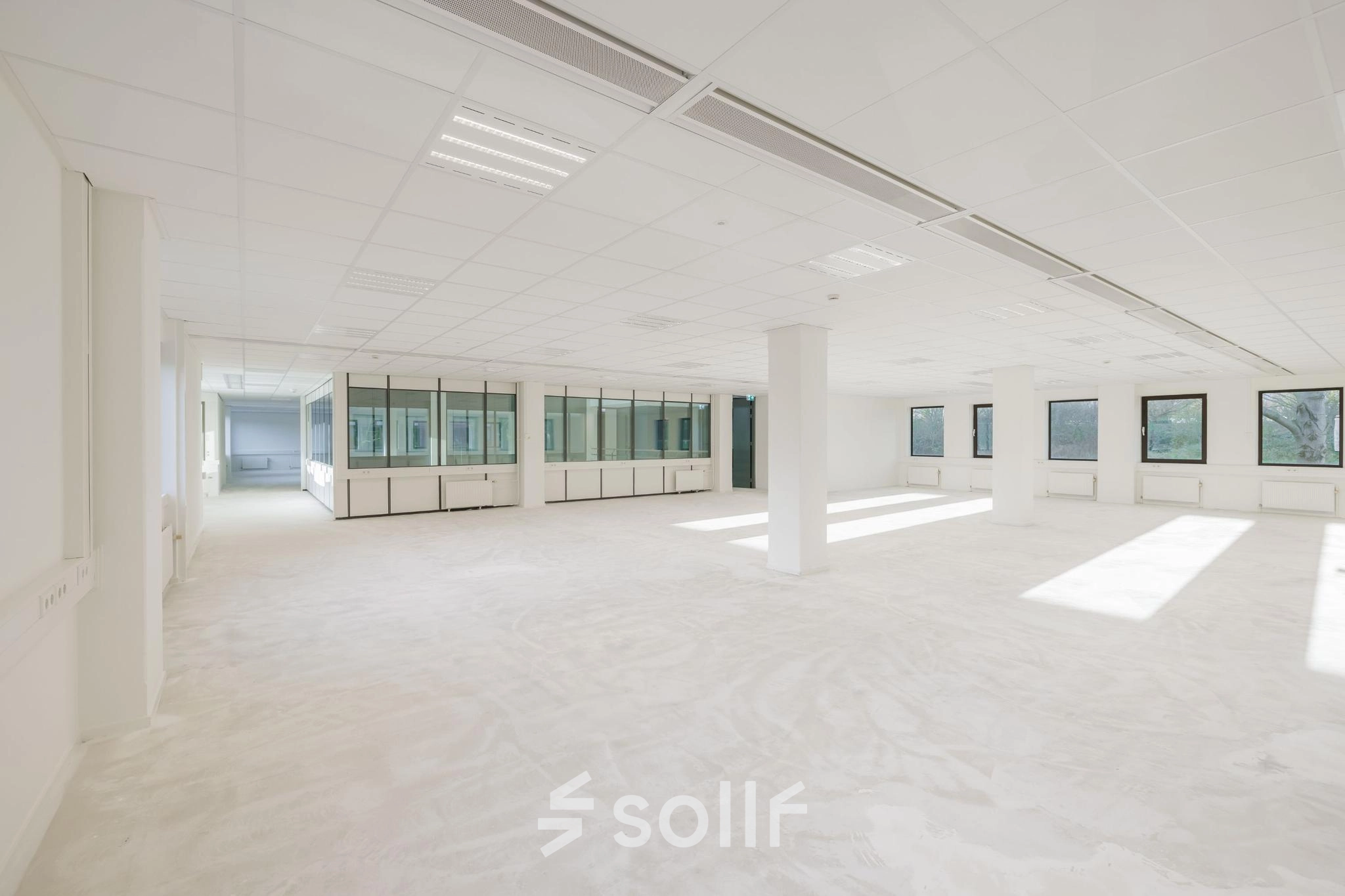 Spacious office interior in Diemen at Wisselwerking 40-48, available for office space rental. Large windows provide ample natural light, with a clean and open floor plan ideal for businesses seeking office to rent.