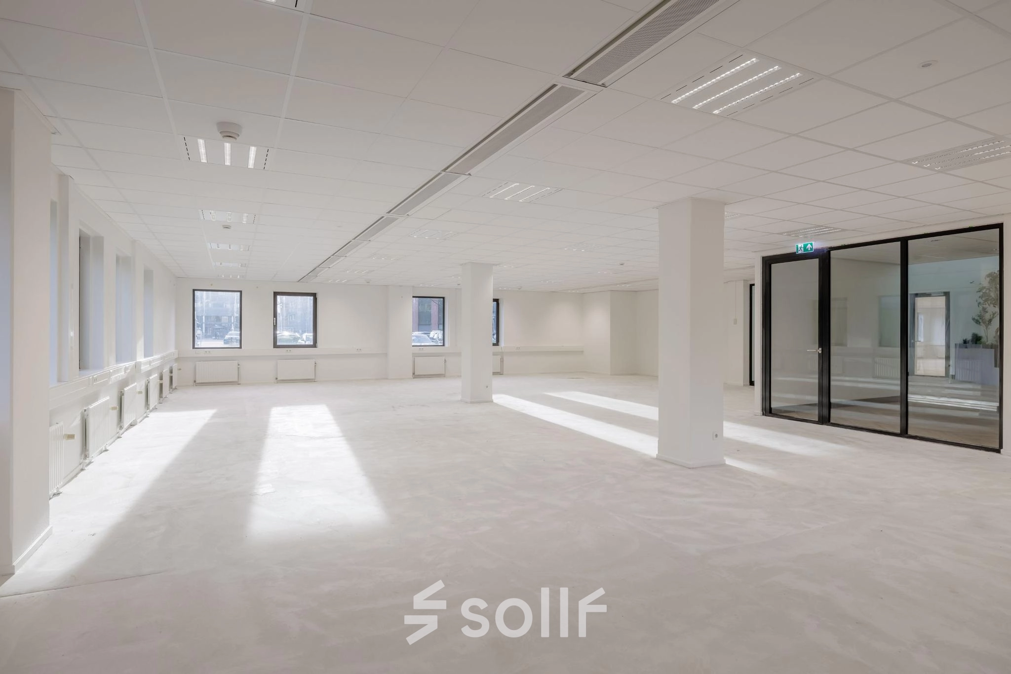 Spacious office layout available for rent at Wisselwerking 40-48, Diemen, featuring expansive windows and ample room for customization in an open layout ideal for office space rental.