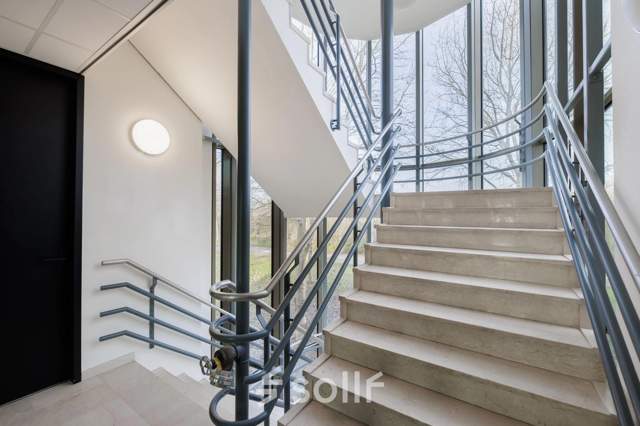 Staircase at Wisselwerking 40-48 in Diemen, ideal for office space rental with sleek design and ample natural light.