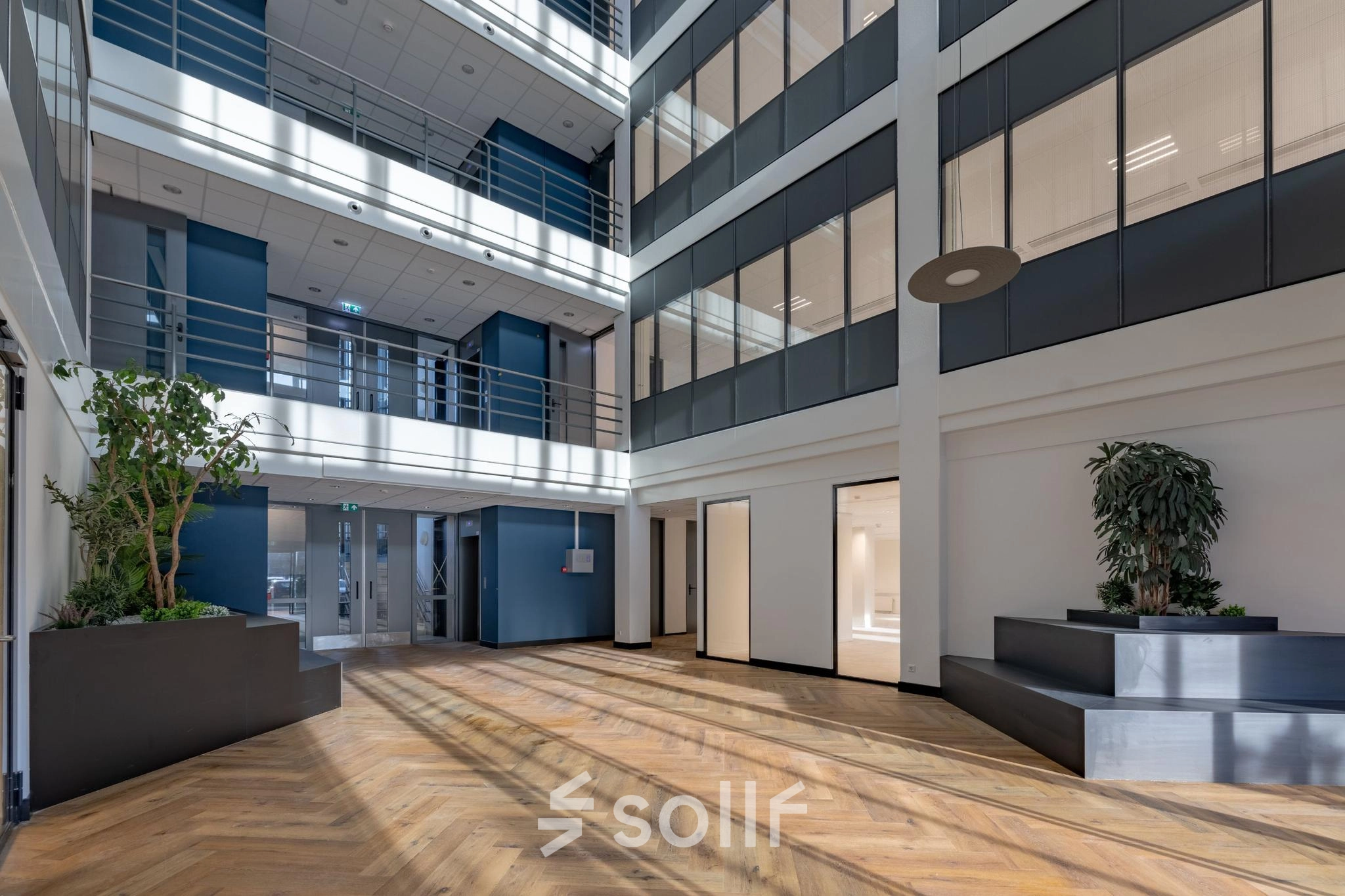 Spacious and modern office lobby with natural light streaming through large windows at Wisselwerking 40-48, Diemen. Ideal for office space rental with sleek design.