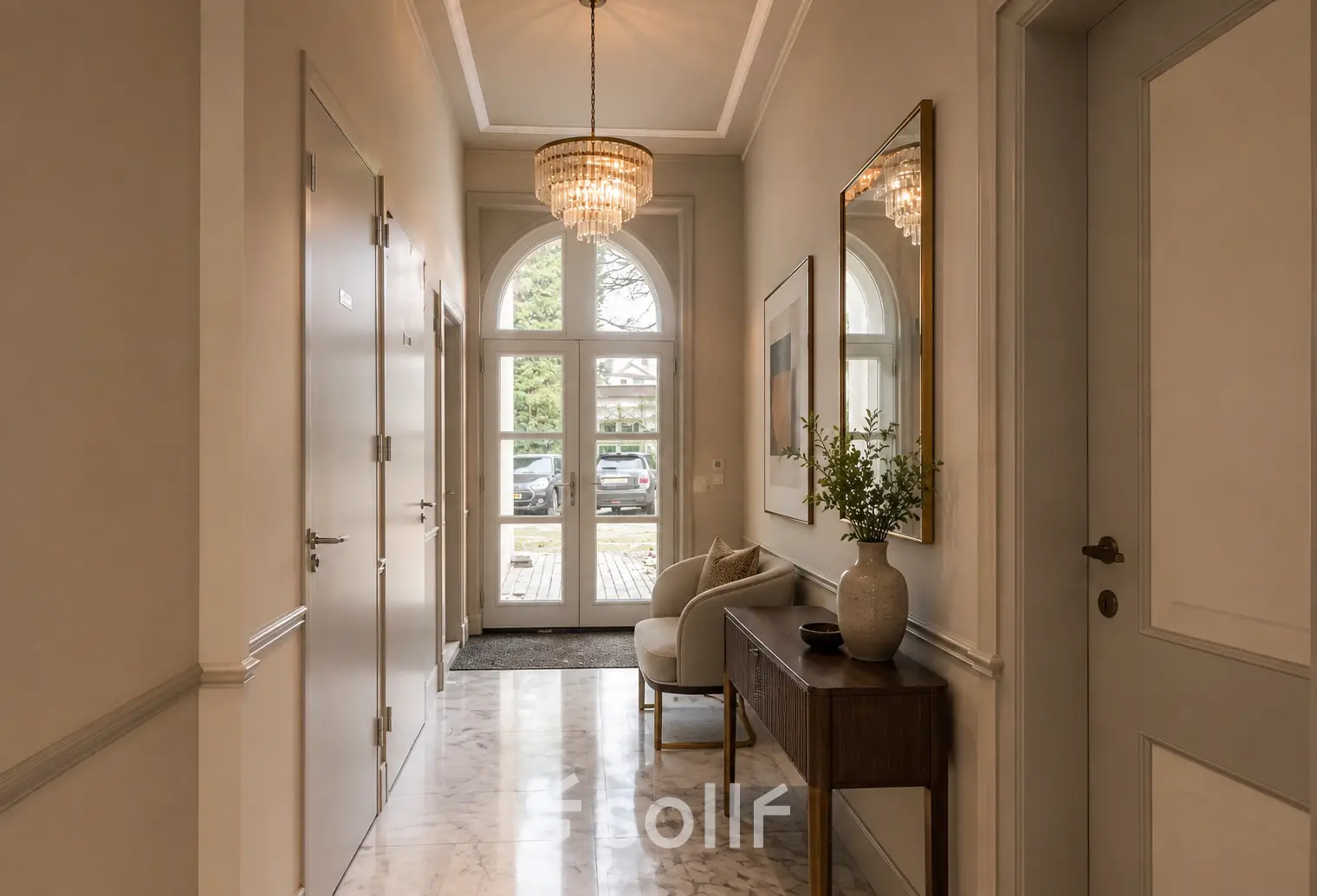 Elegant entrance at Dorpsstraat 77, Doorn, ideal for an inviting office space rental. Bright foyer with chandelier and cozy seating area, perfect for welcoming visitors.